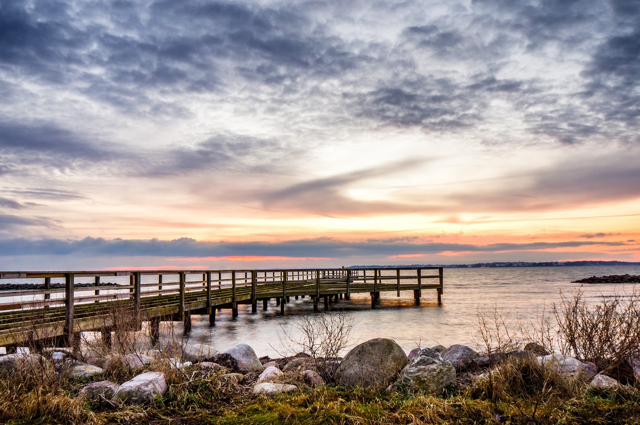 Wooden pier on the coast at sunset HD Wallpaper