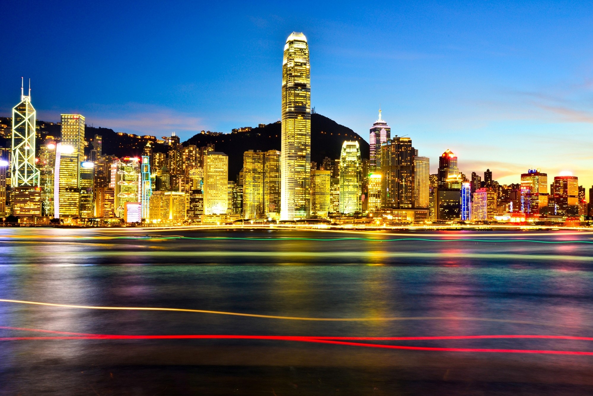 Hong Kong skyline at night with harbor lights HD Wallpaper