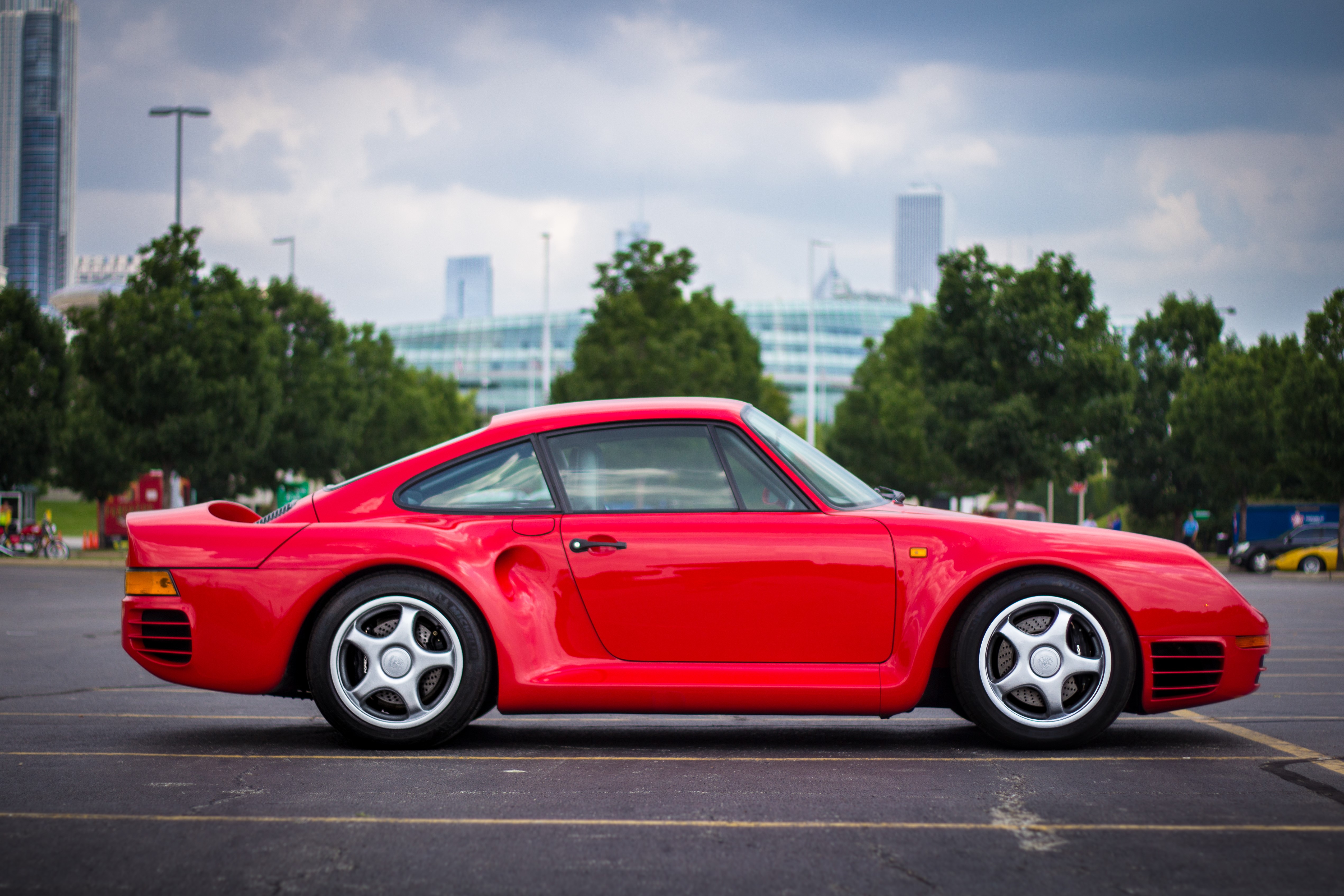 Red Porsche 959 parked on asphalt HD Wallpaper
