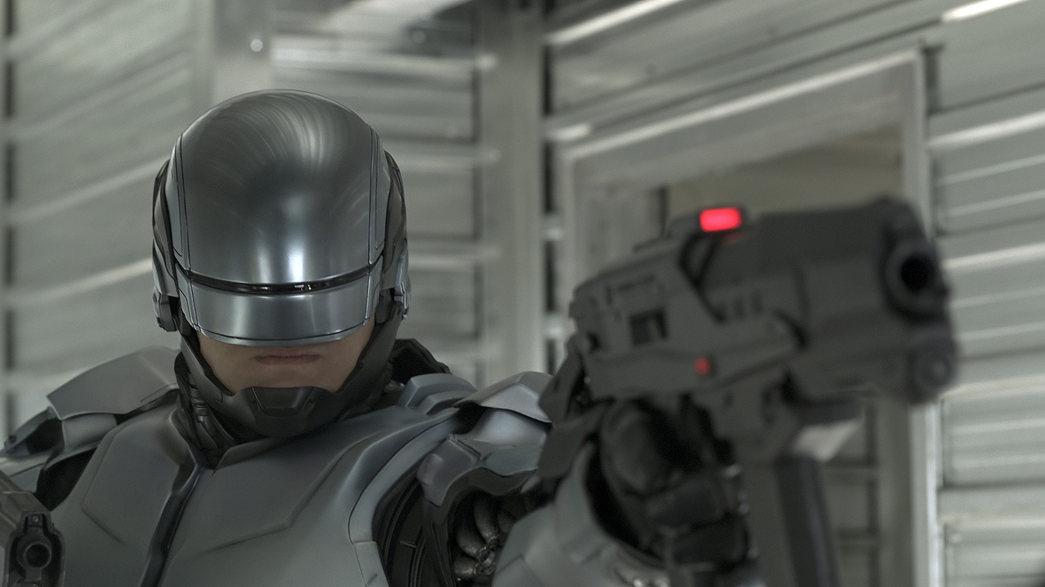 RoboCop from RoboCop holding a gun HD Wallpaper