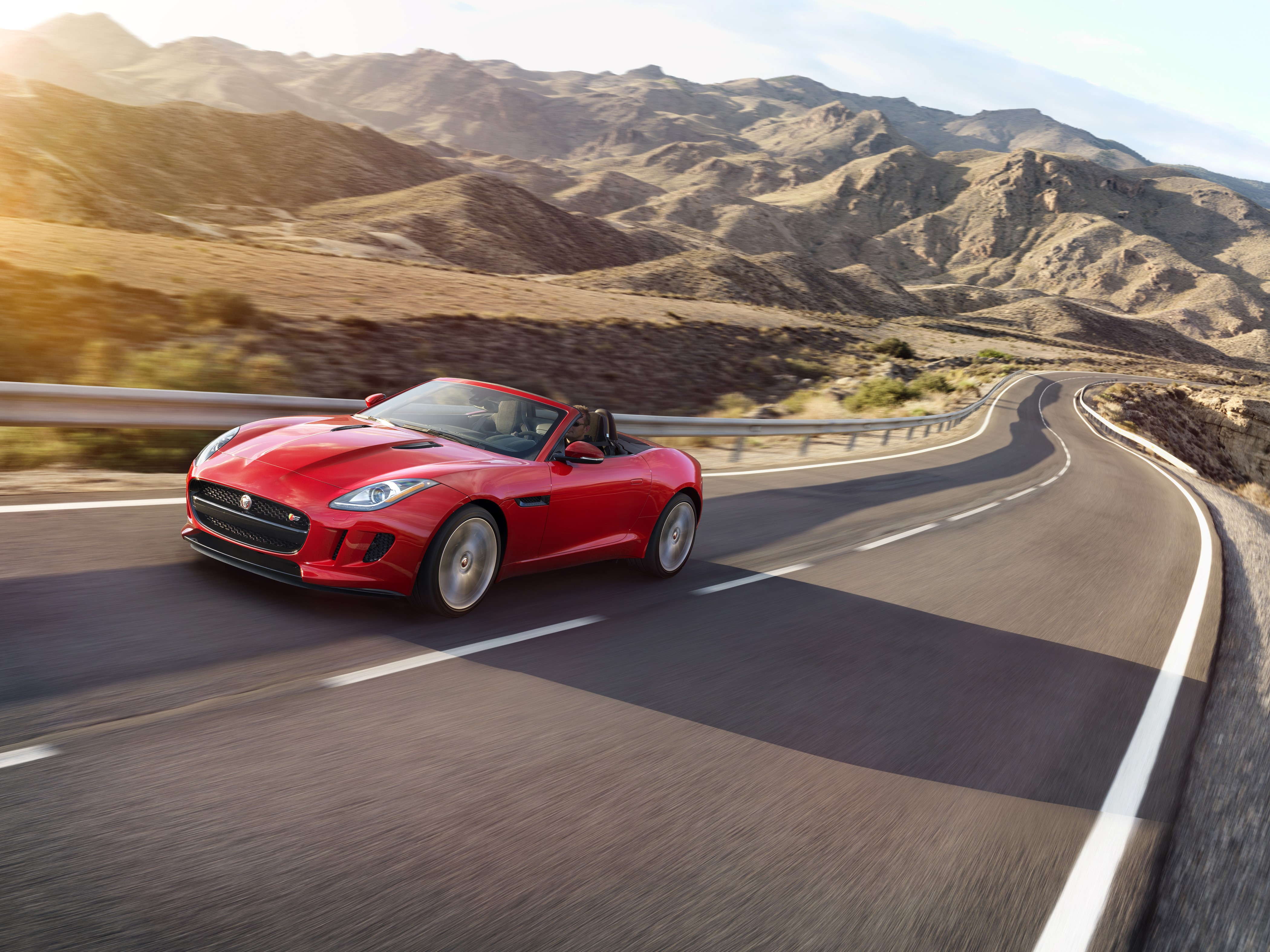 Red 2016 Jaguar F-Type S convertible on a mountain road HD Wallpaper