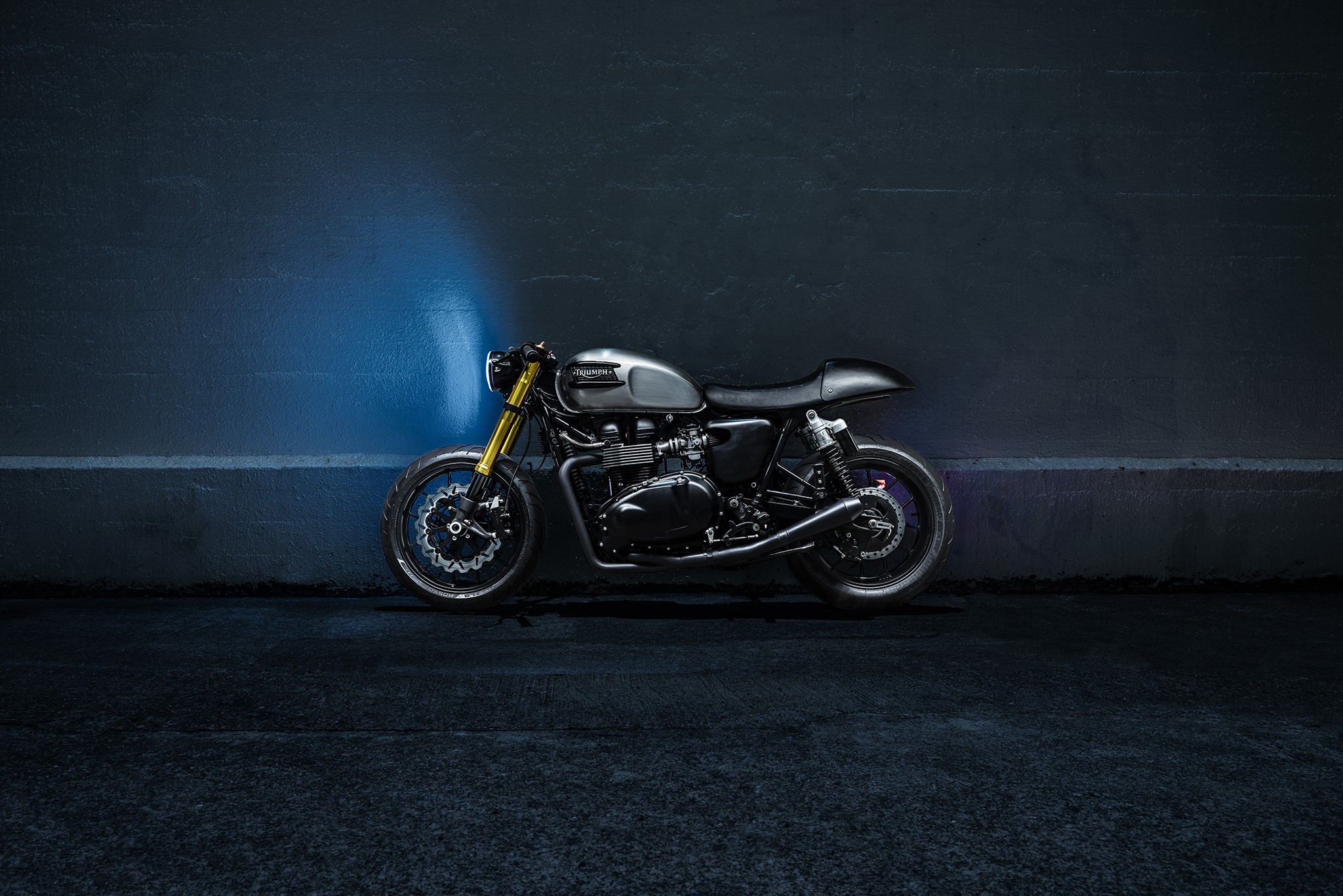 Triumph Bonneville motorcycle parked at night HD Wallpaper