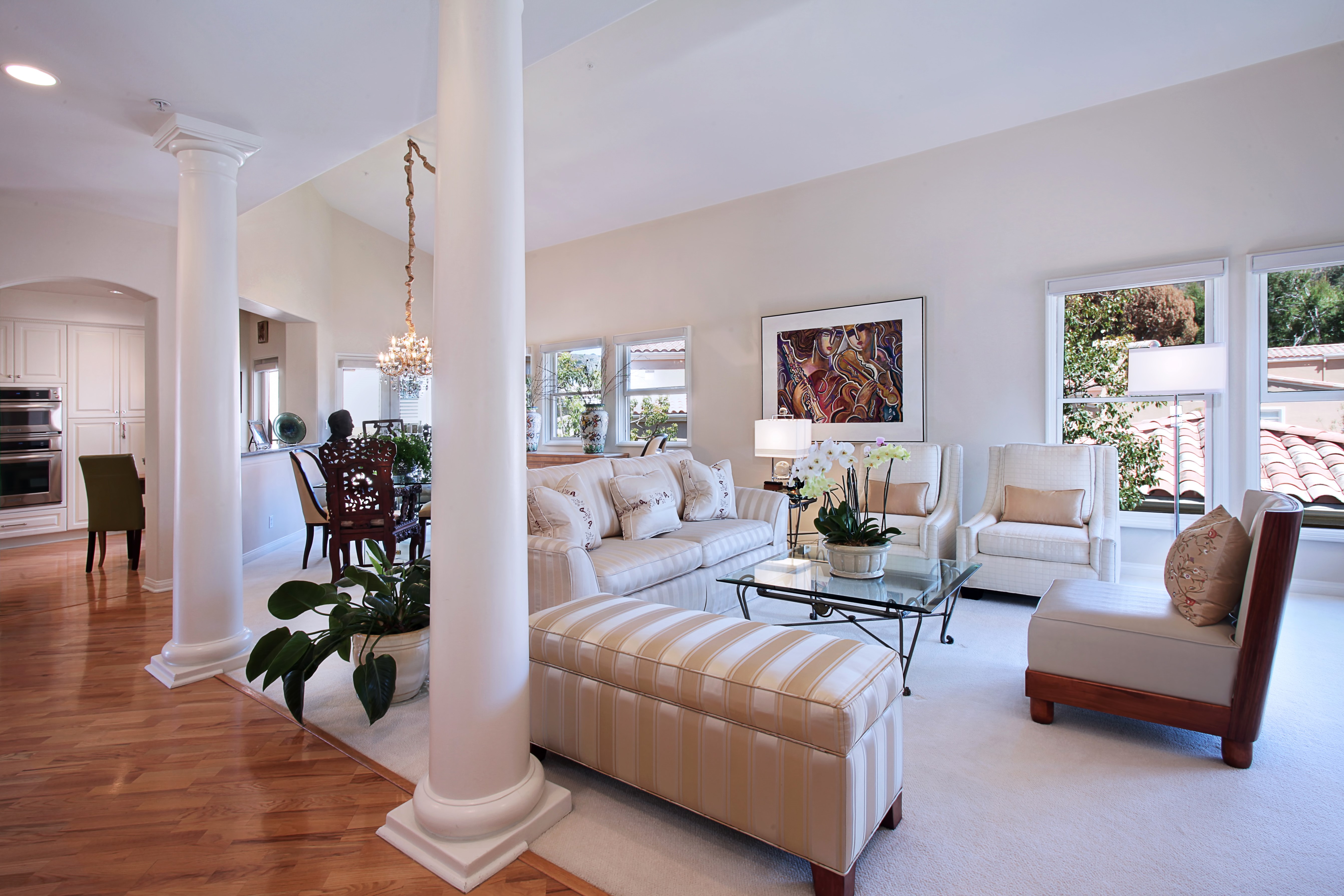 Living room with sofa, armchairs, and dining area HD Wallpaper