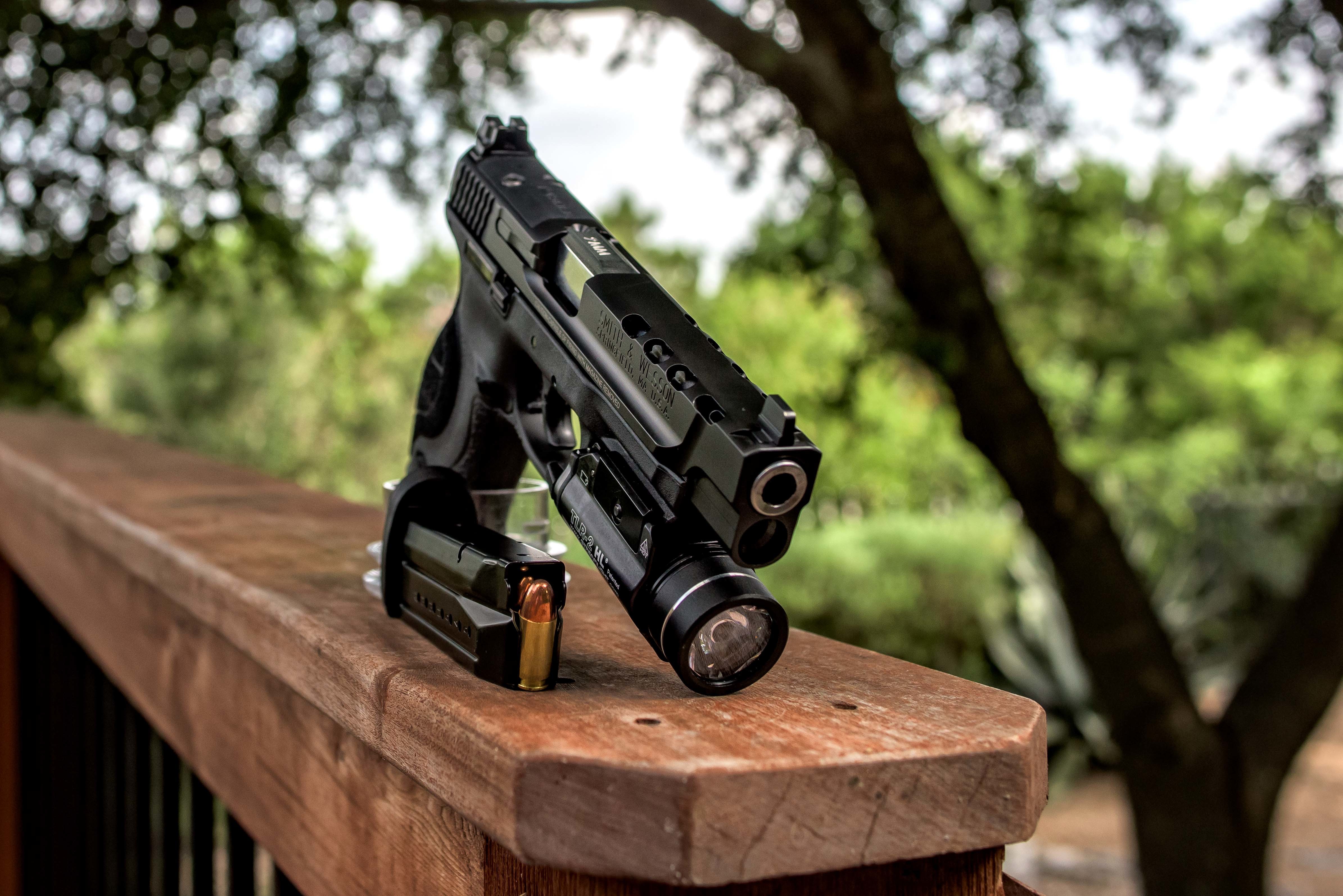 4K Smith & Wesson Pistol with Magazine and Bullet HD Wallpaper