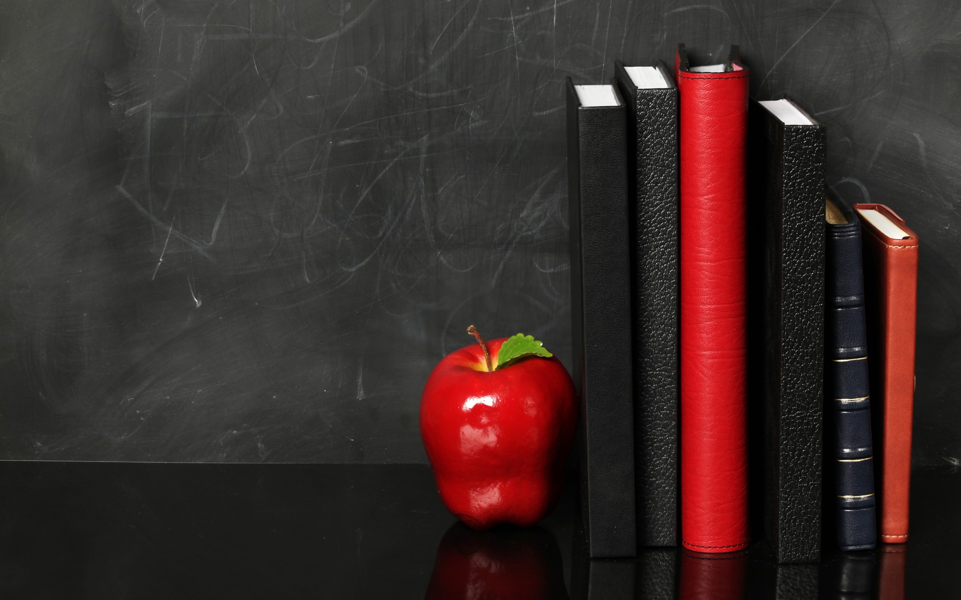 Red apple and books on a chalkboard background HD Wallpaper