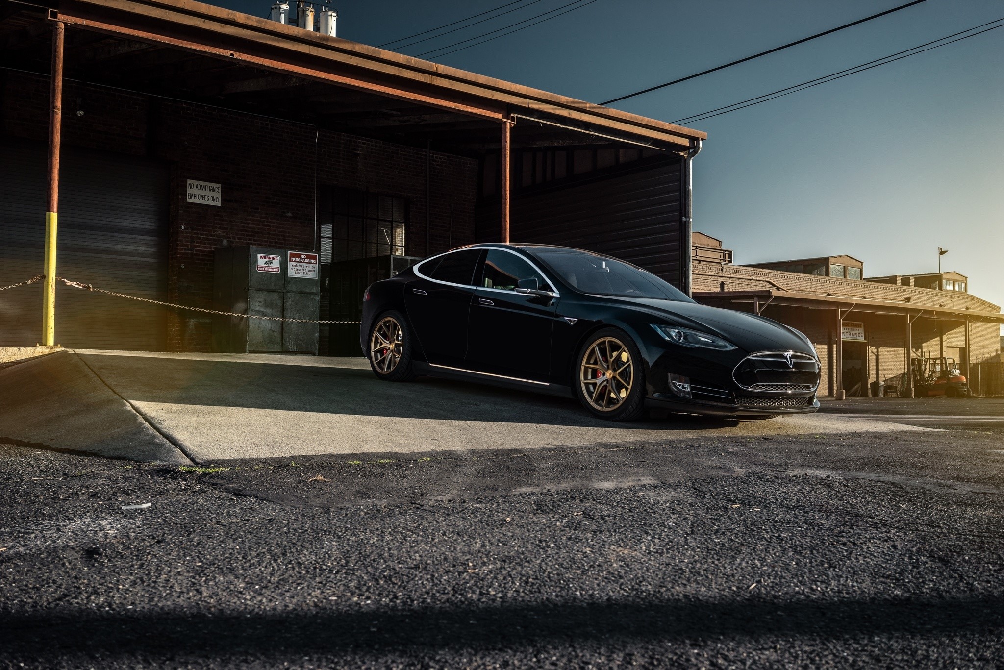 Black Tesla Model S P85 parked in a garage HD Wallpaper