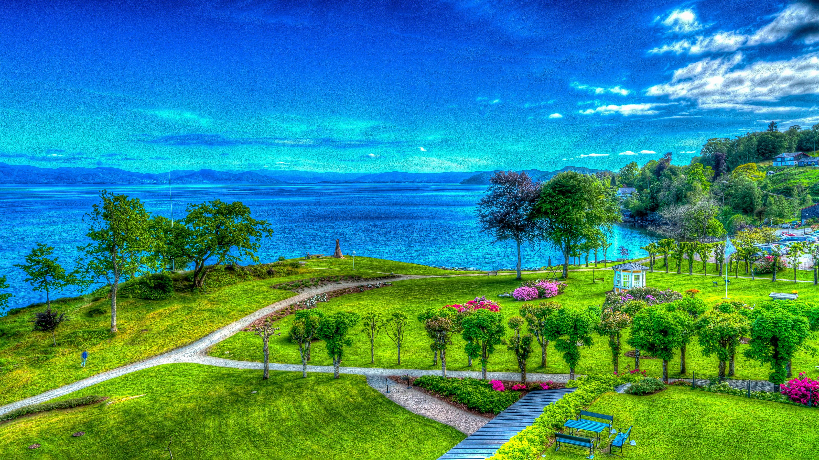 Park with lake and distant mountains HD Wallpaper