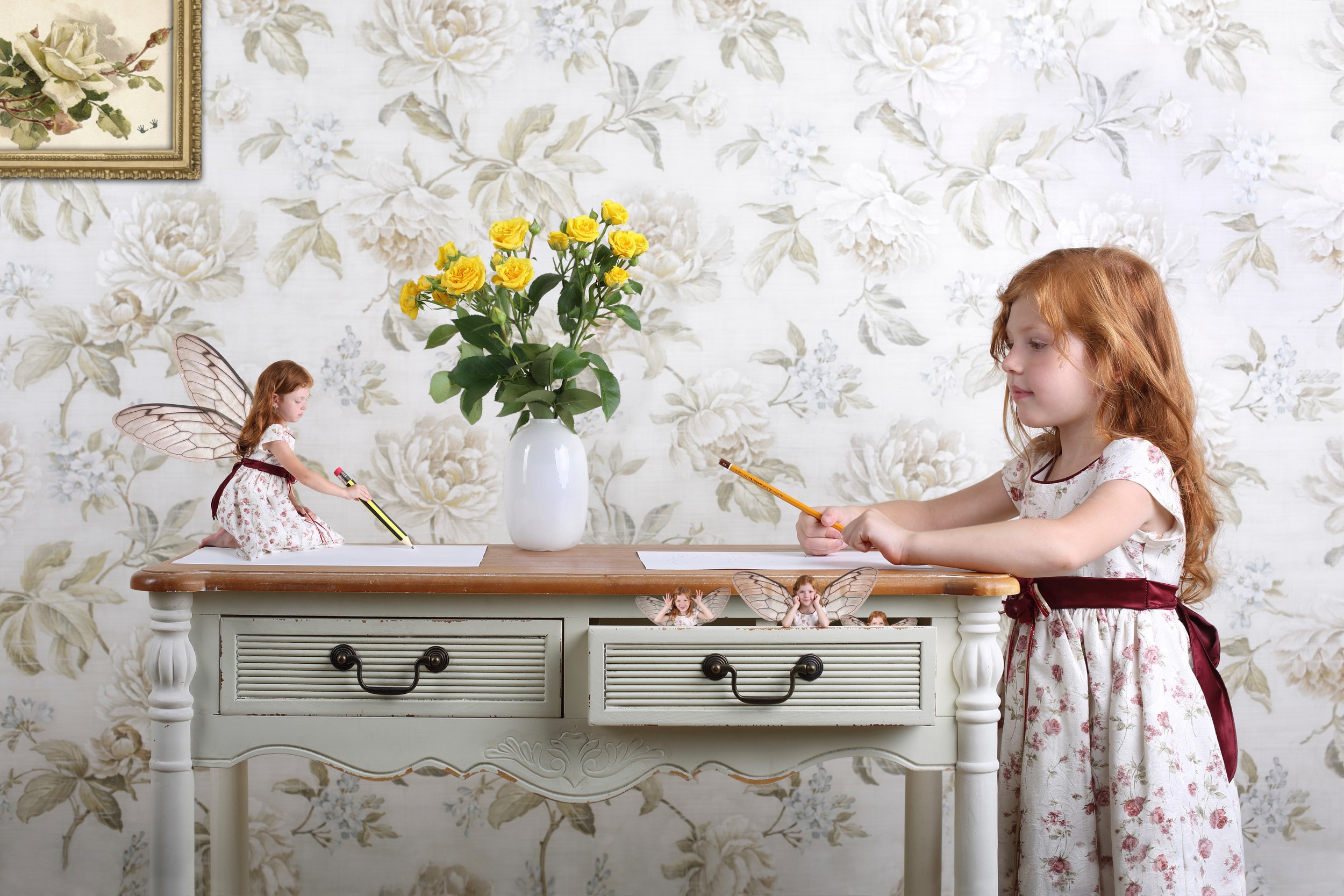 Girl and fairy drawing at a desk HD Wallpaper