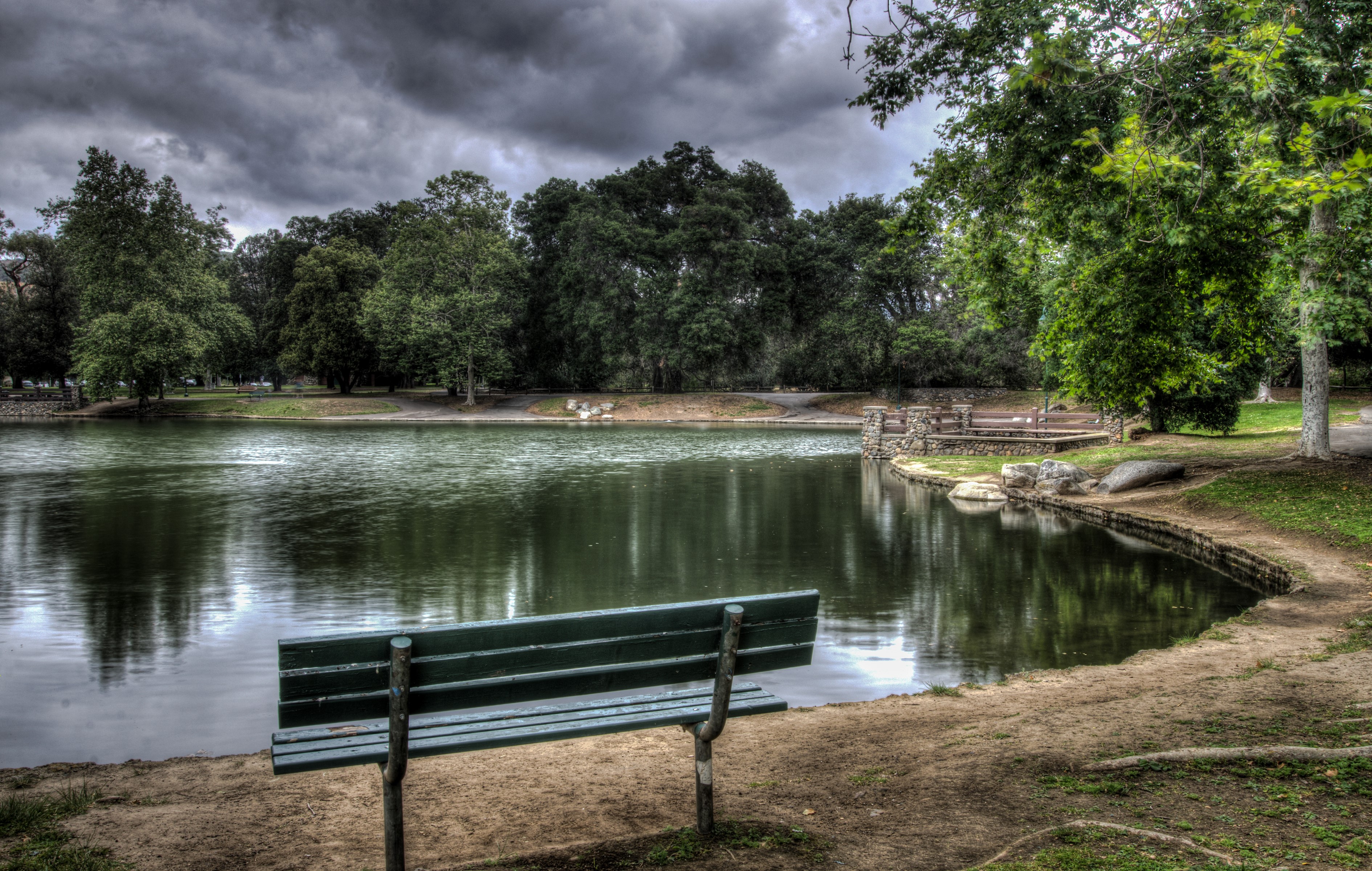 Bench by a lake in Irvine Regional Park, California HD Wallpaper
