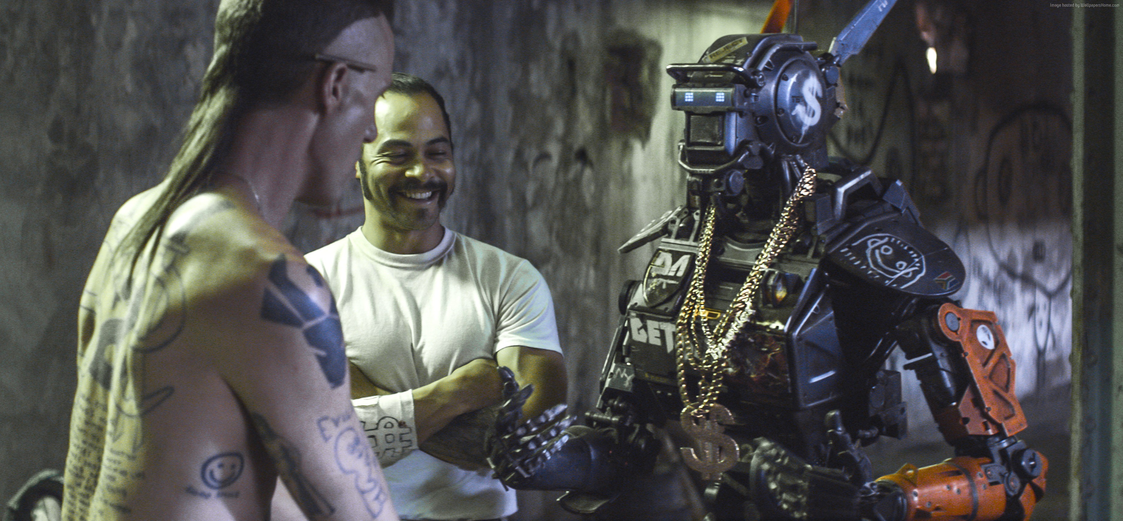 Chappie with two men in a gritty environment HD Wallpaper