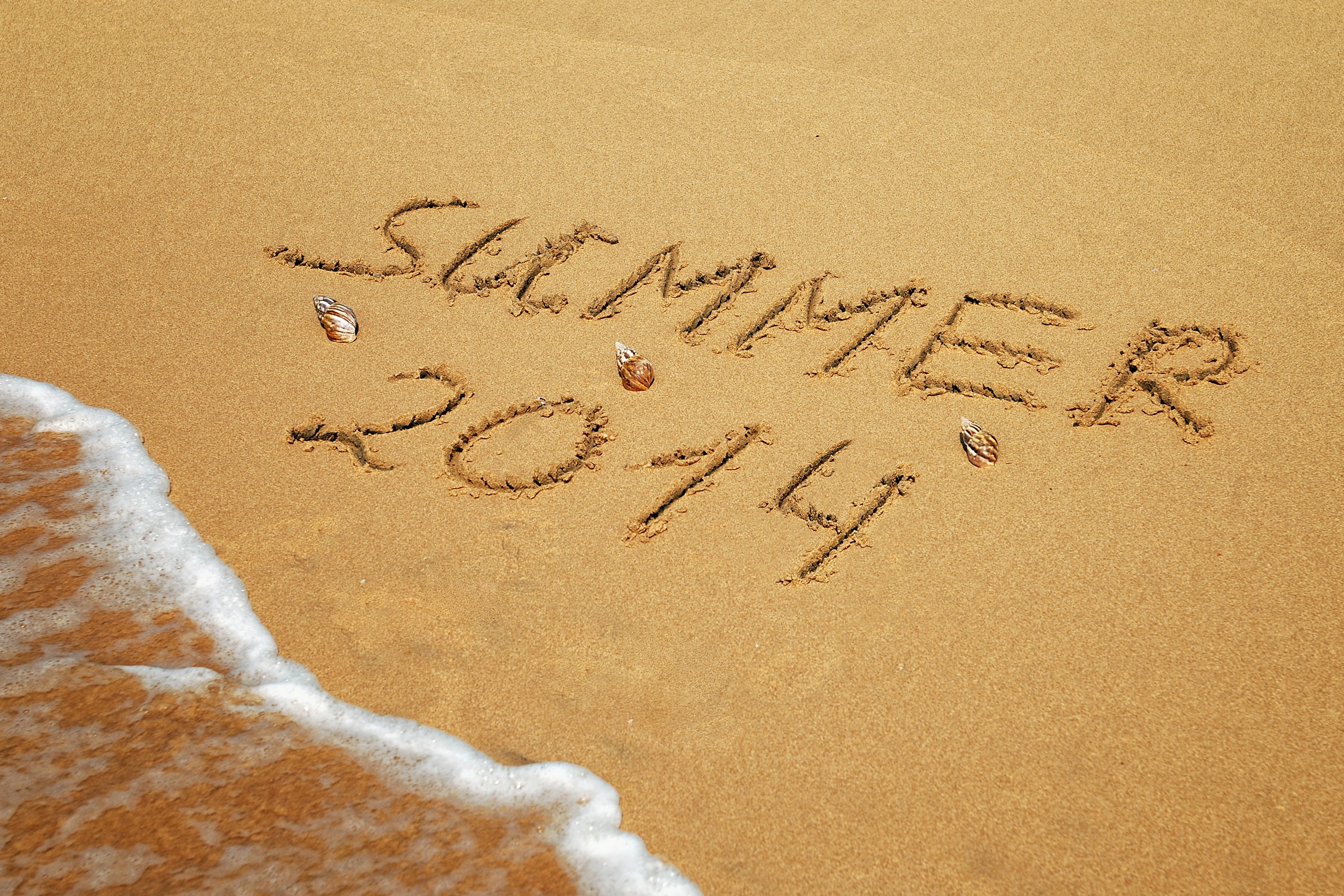 Summer 2014 written in sand on a beach HD Wallpaper