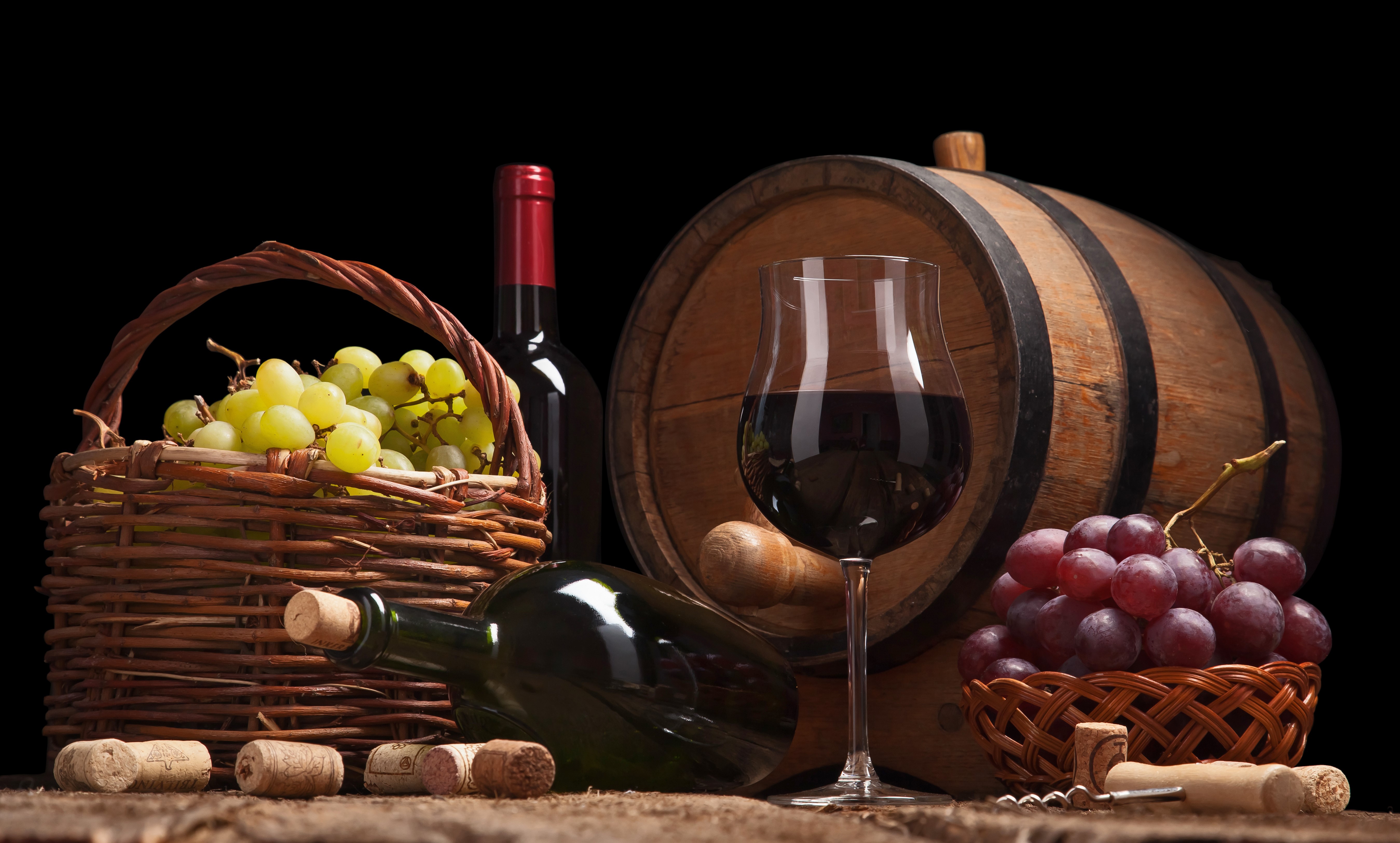 Wine bottle, grapes, glass, and barrel HD Wallpaper