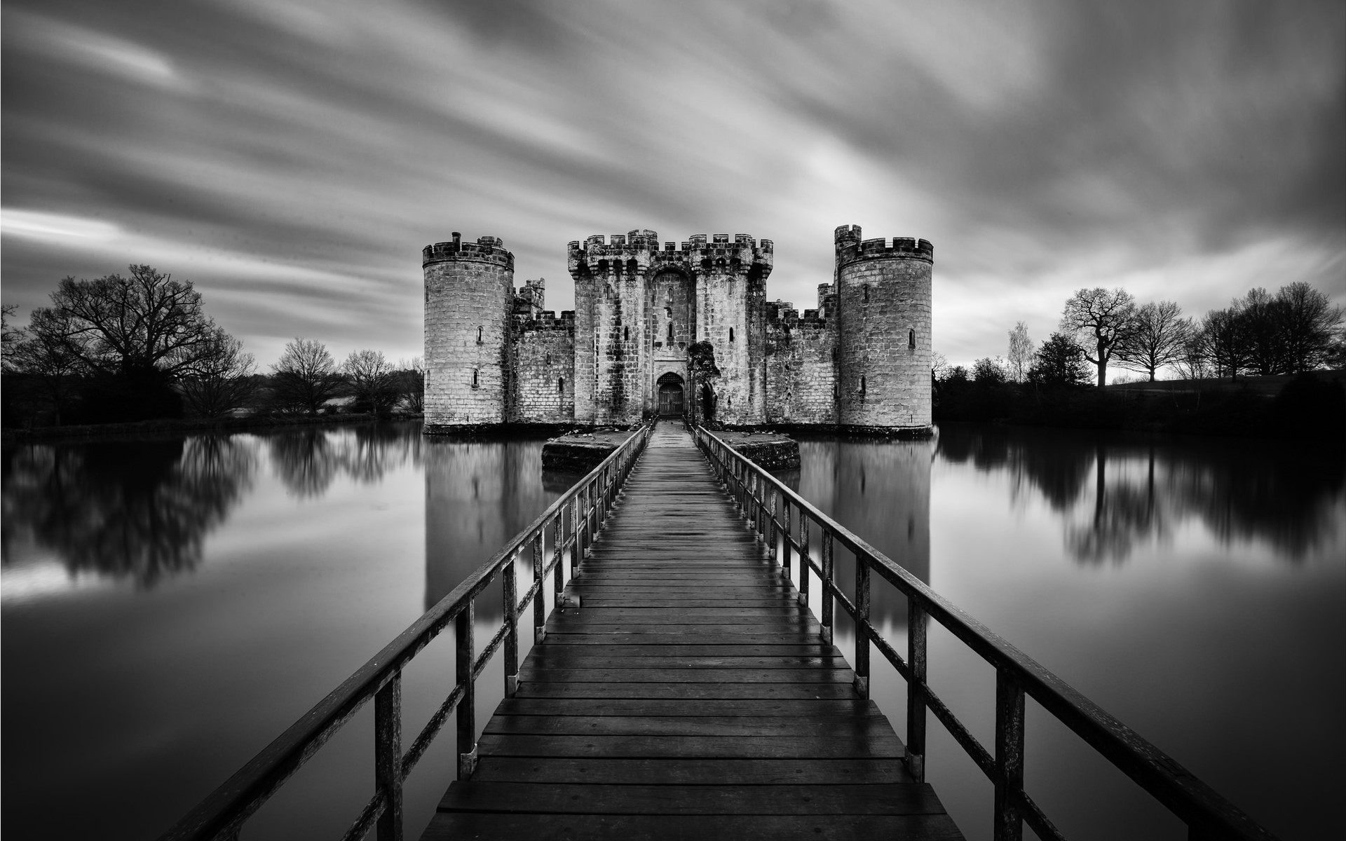 Bodiam Castle with wooden bridge over water HD Wallpaper