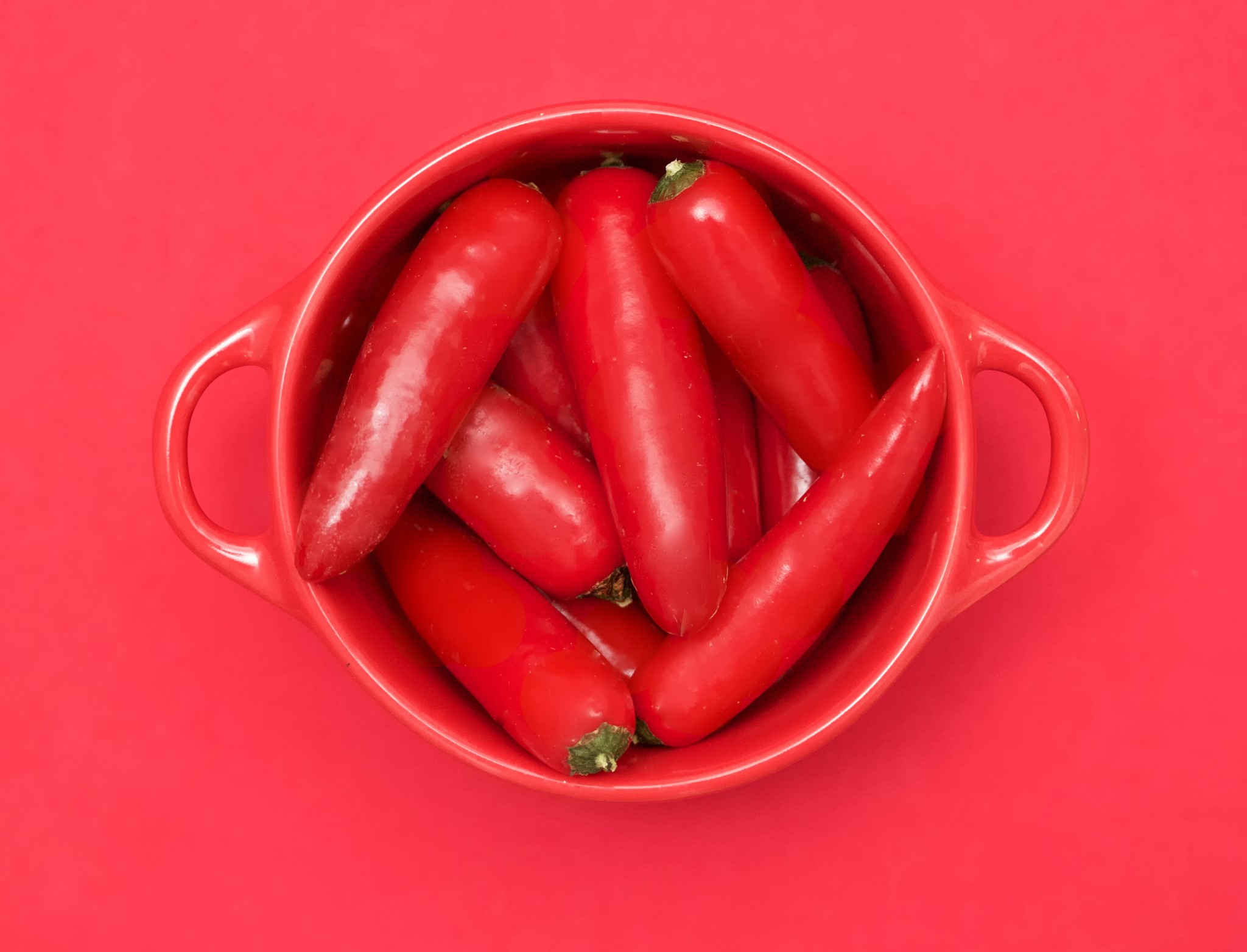 Red chili peppers in a red bowl HD Wallpaper