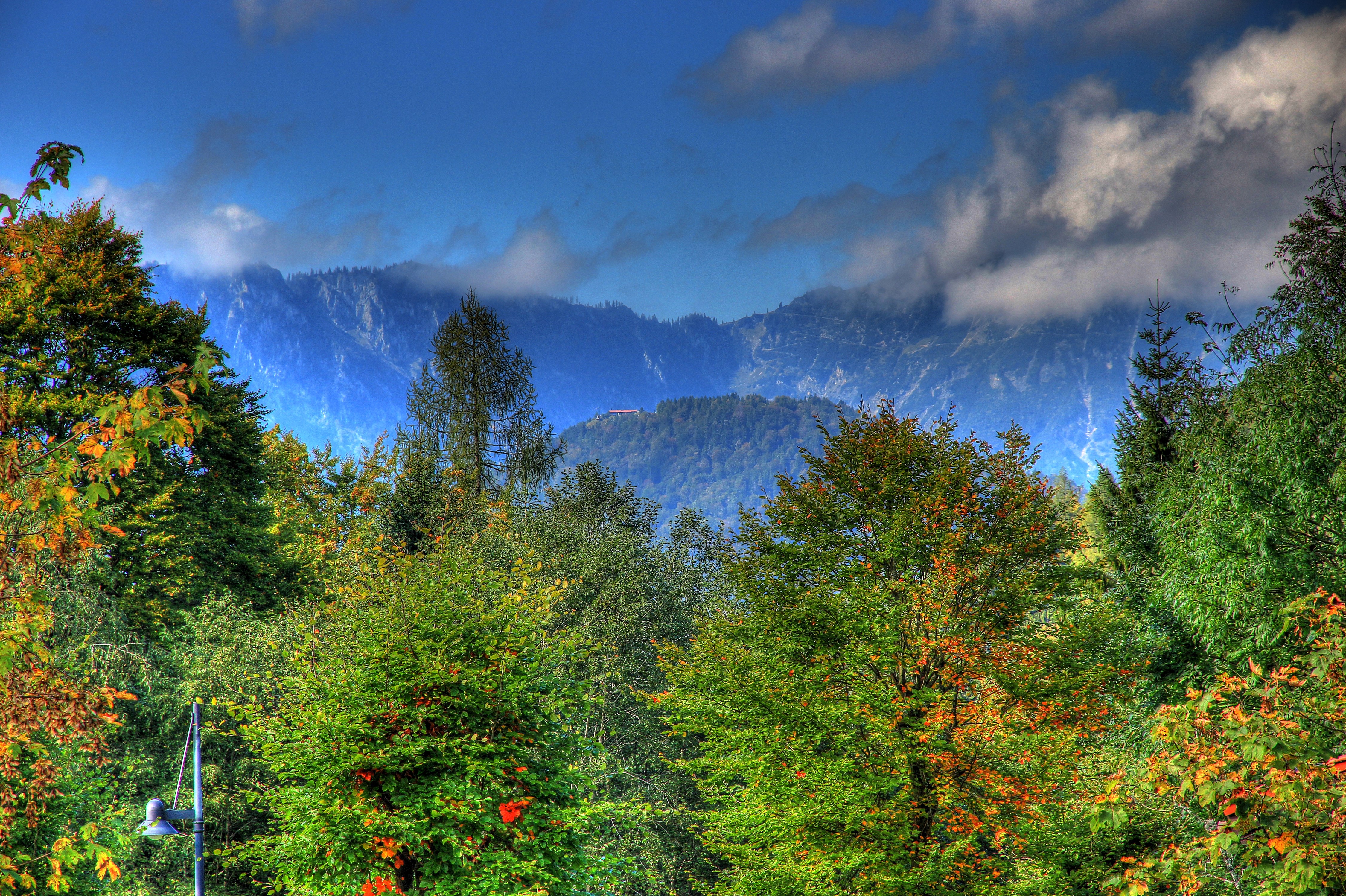 Mountains and trees with clouds HD Wallpaper