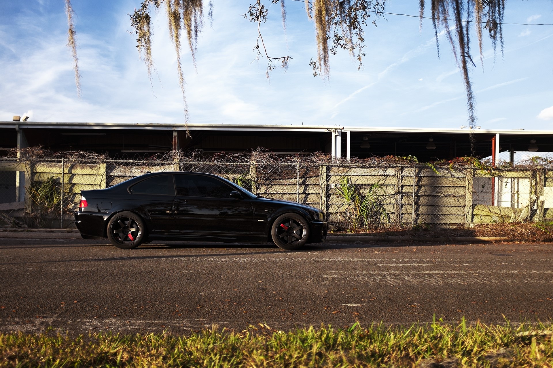 Black BMW M3 E46 parked on the side of the road HD Wallpaper