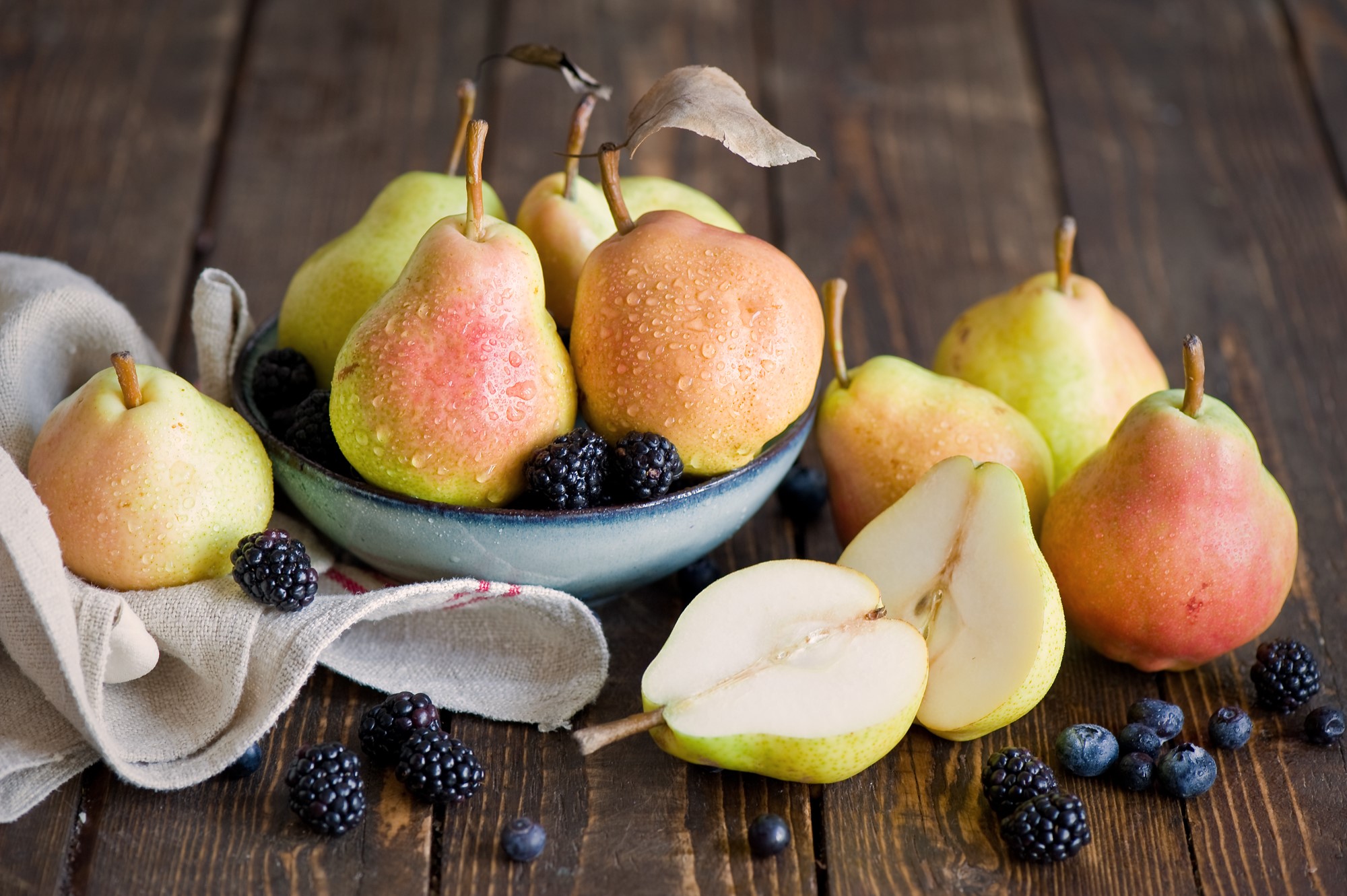 Pears and berries on a wooden table HD Wallpaper