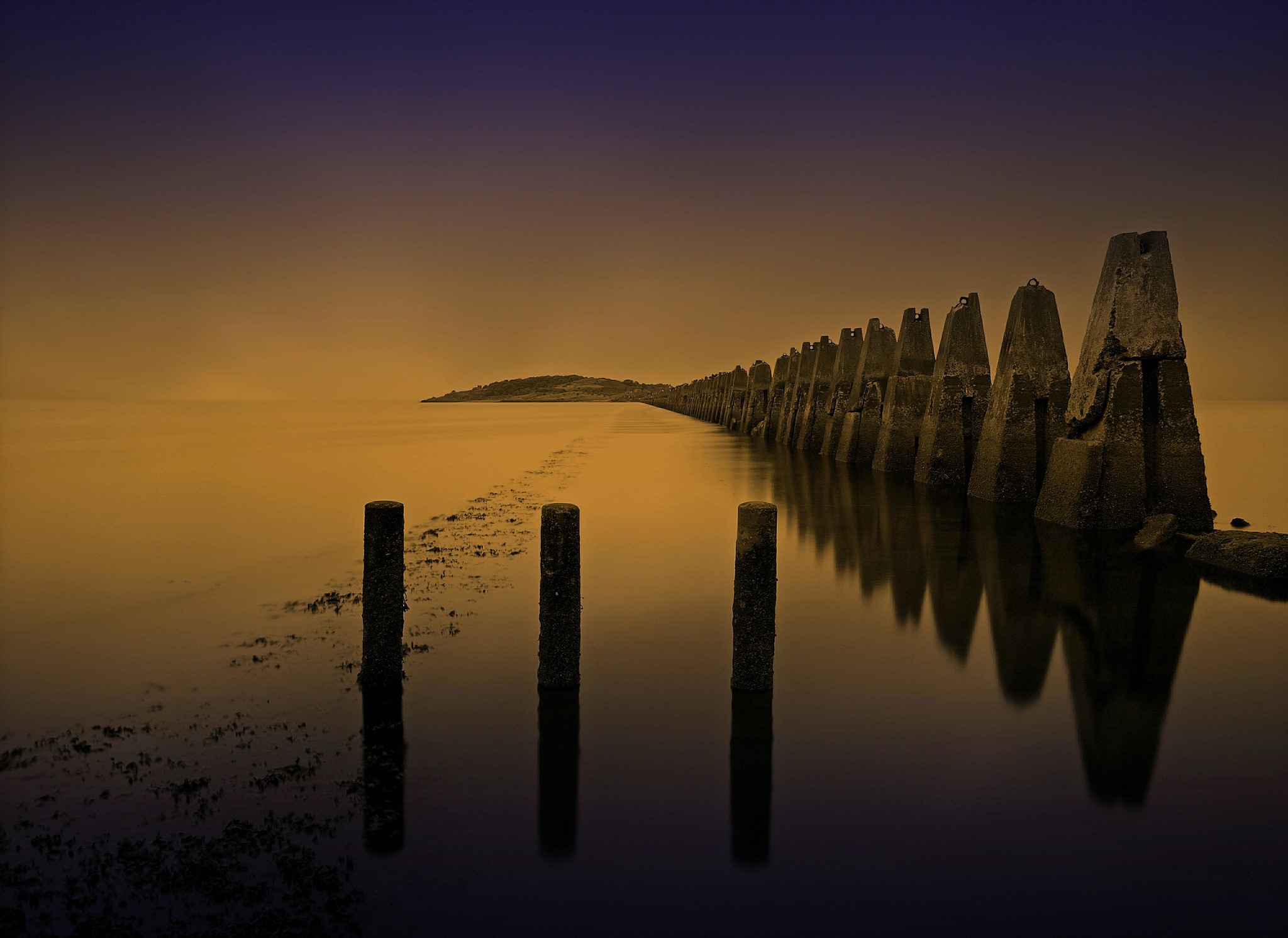 Concrete breakwater and posts in the sea at Cramond, Scotland HD Wallpaper
