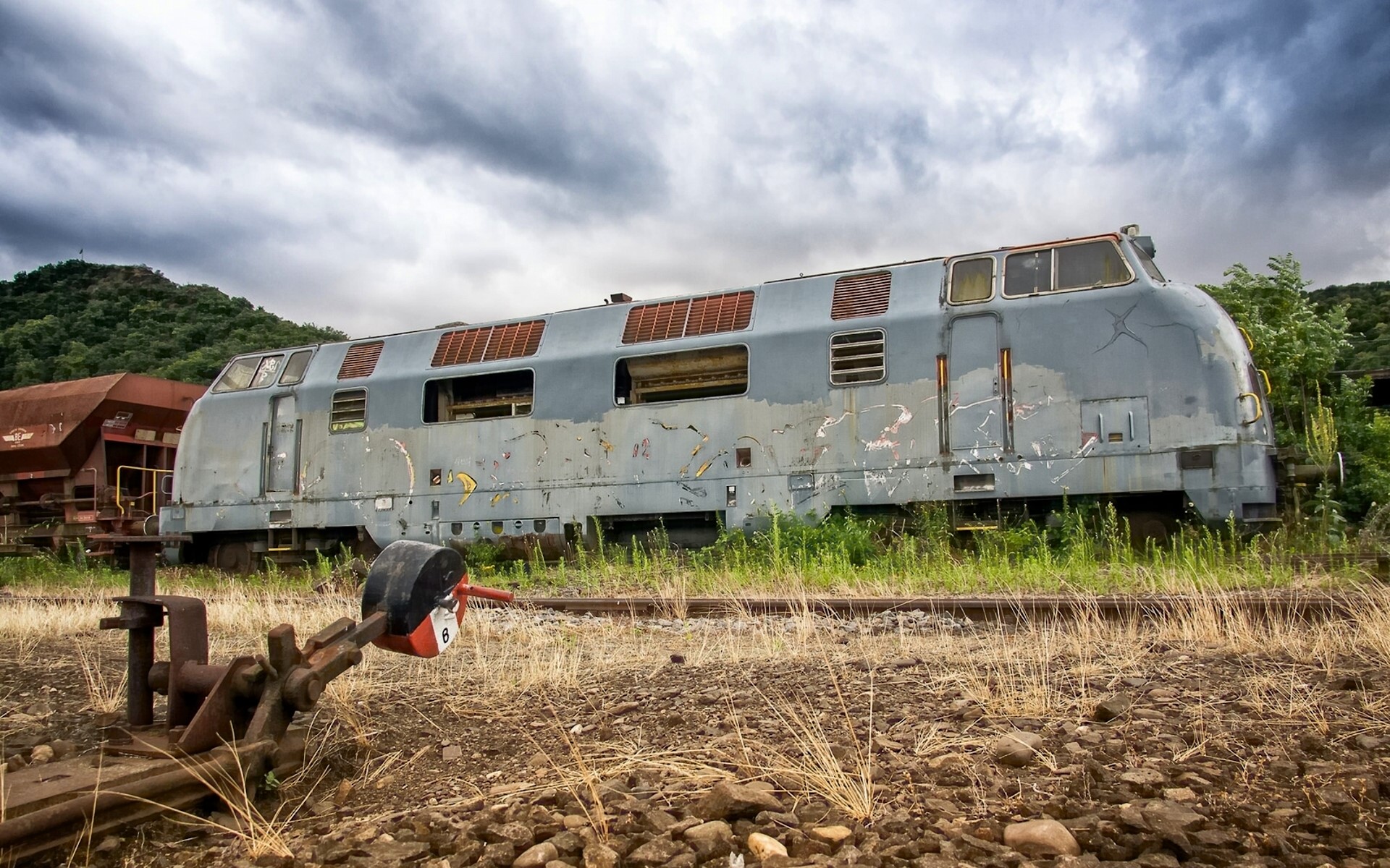 Abandoned train locomotive and rail switch HD Wallpaper
