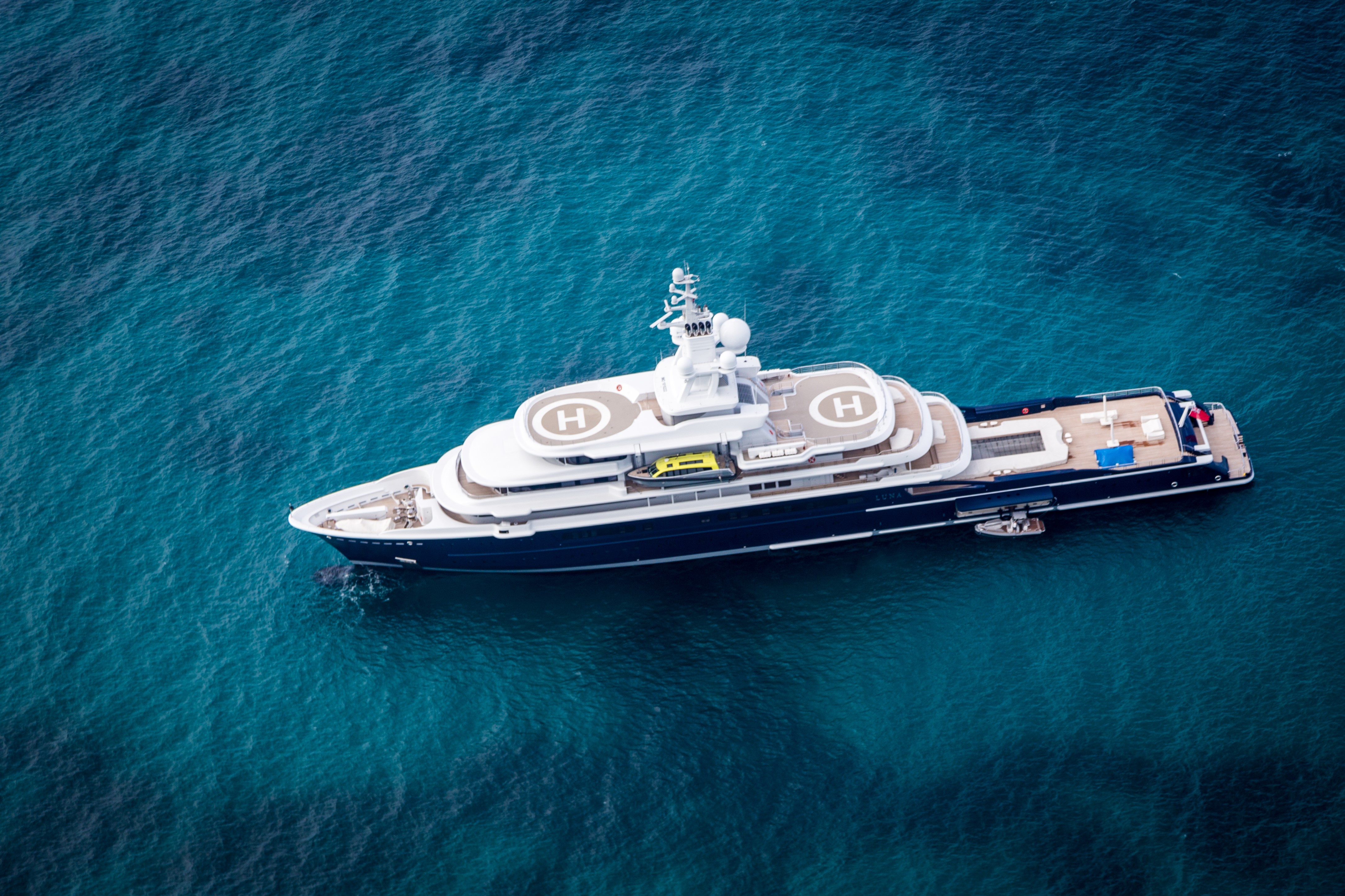 Aerial view of a large luxury yacht at sea HD Wallpaper