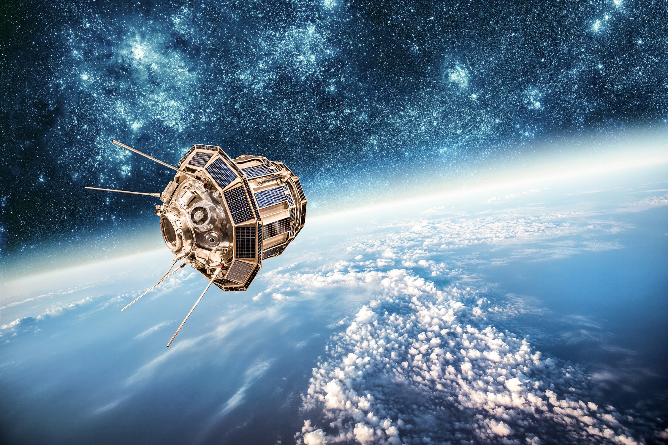 Satellite orbiting Earth with stars in the background HD Wallpaper