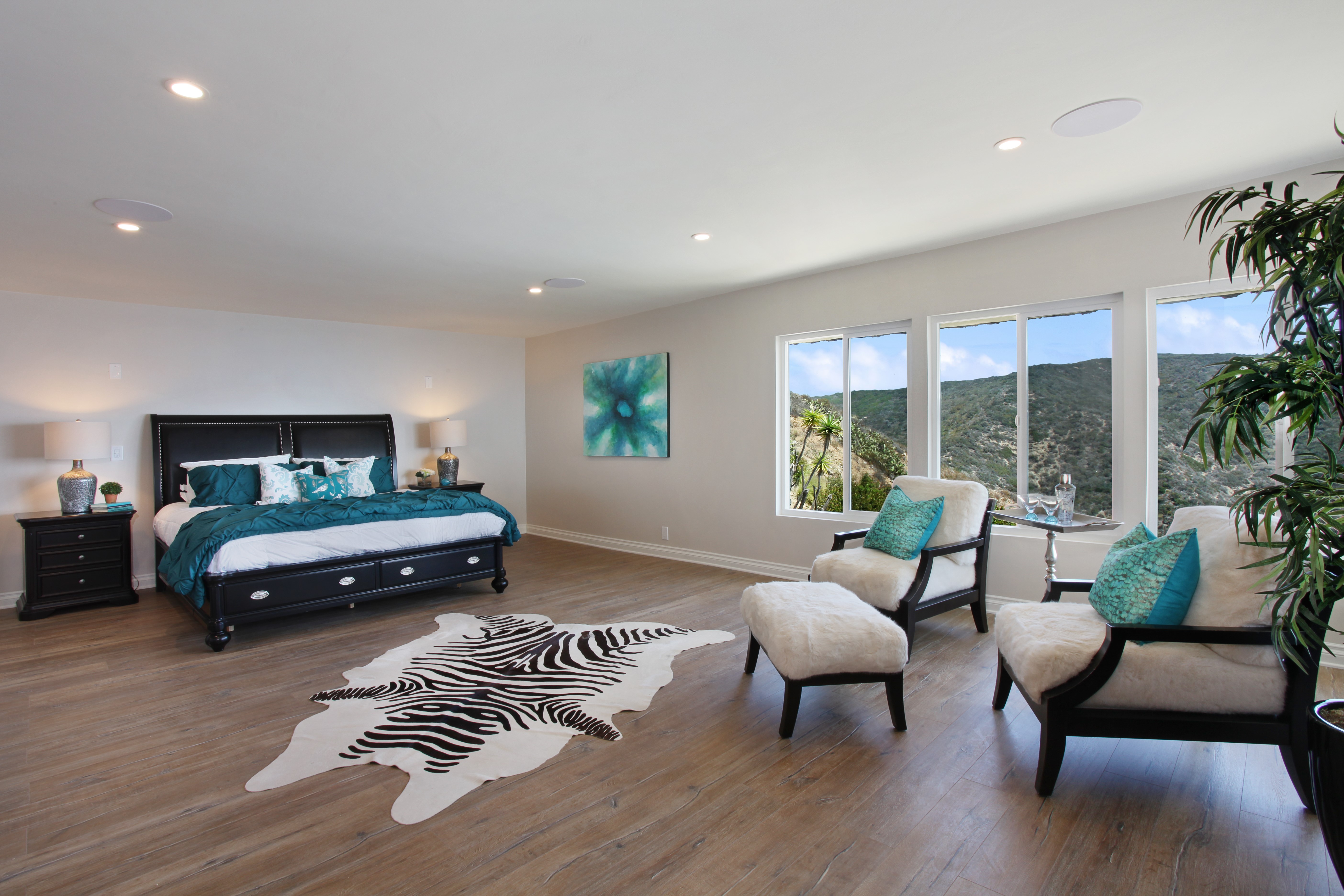 Bedroom with a large bed, armchairs, and mountain view HD Wallpaper