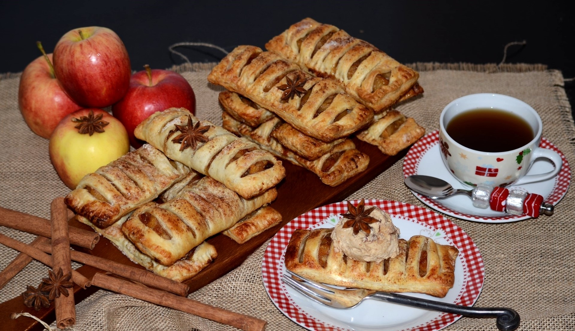 Apple pastries with tea and cinnamon sticks HD Wallpaper