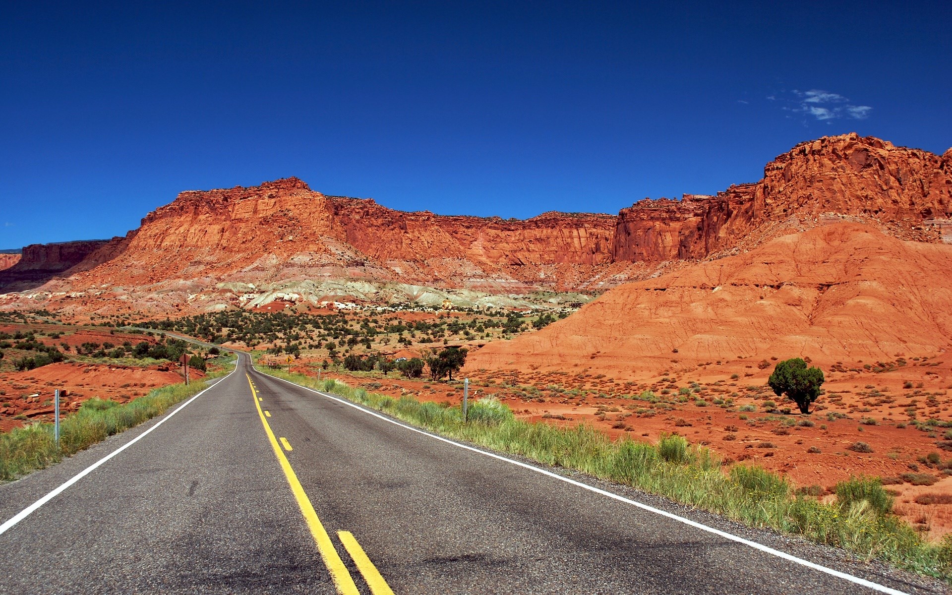 Desert Road Leading to Red Rock Mountains HD Wallpaper