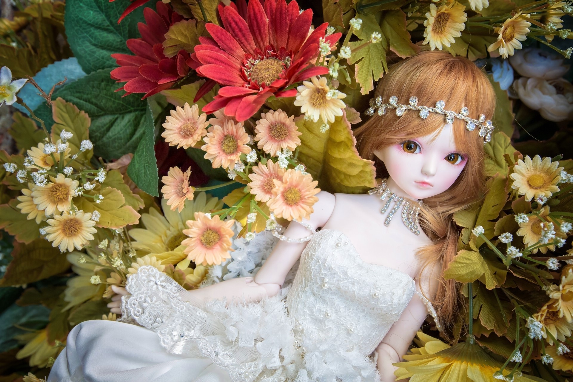 Doll wearing a white dress and jewelry among flowers HD Wallpaper