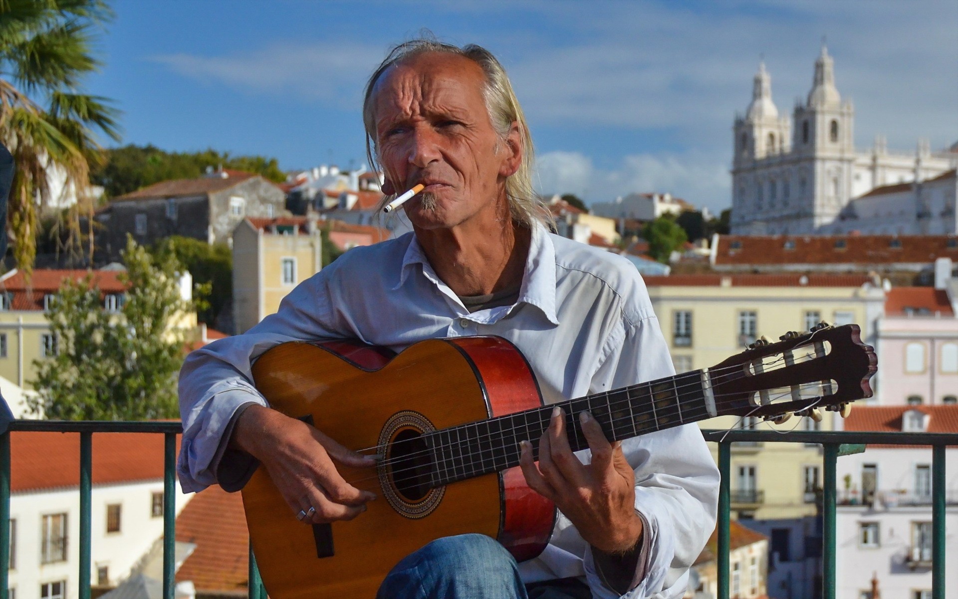 Old man playing guitar with a cigarette HD Wallpaper
