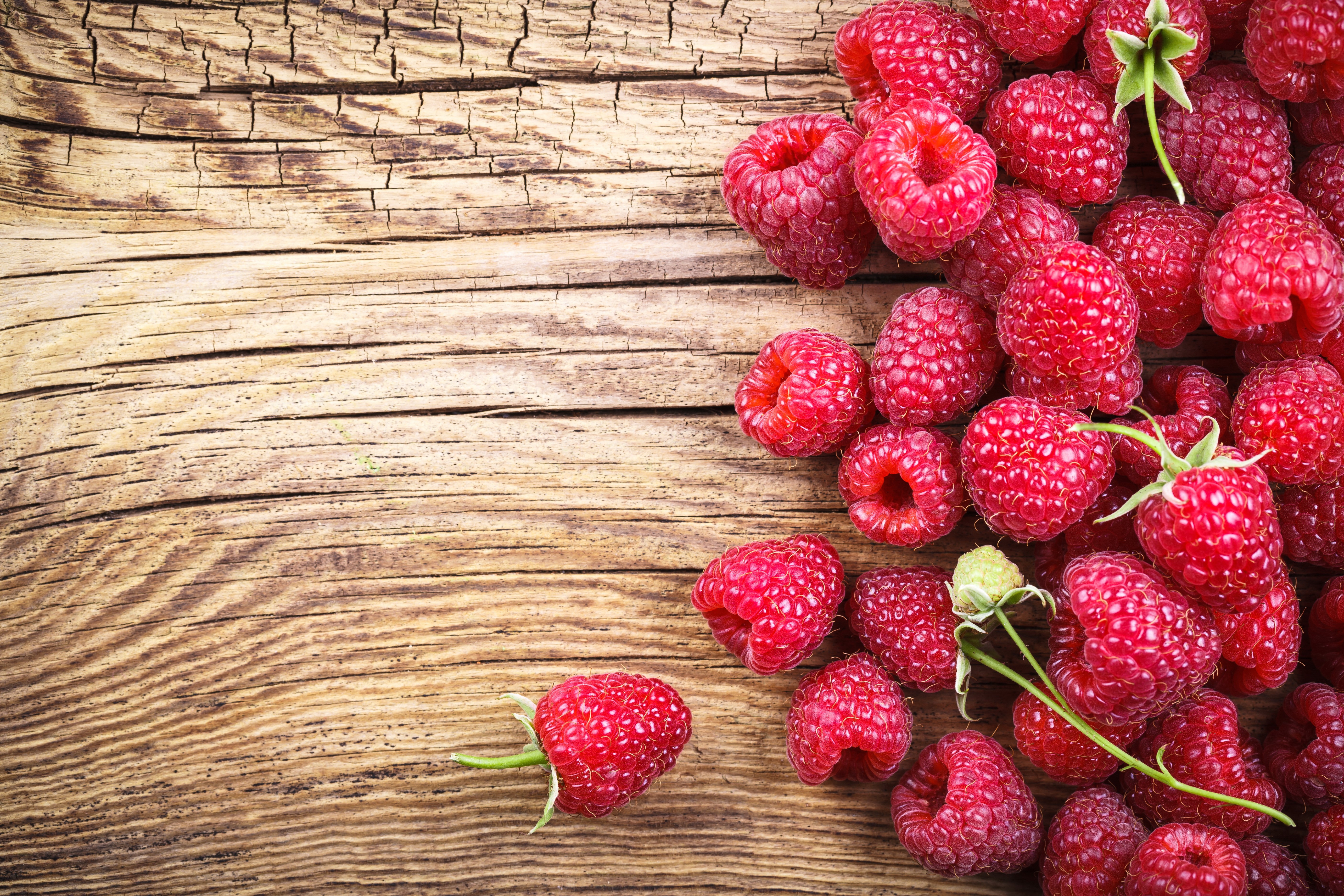 Raspberries on a wooden surface HD Wallpaper
