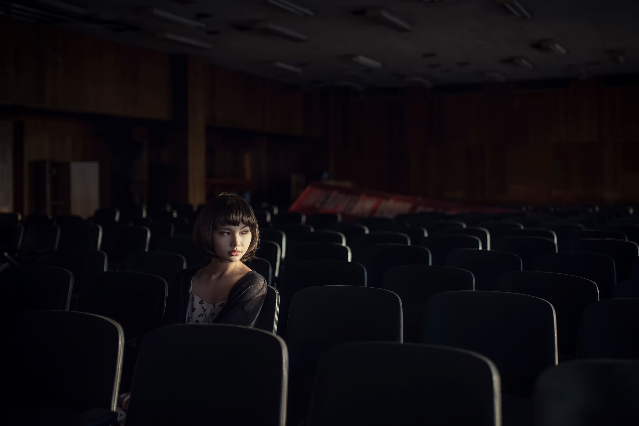 Karina Kim in an empty auditorium HD Wallpaper