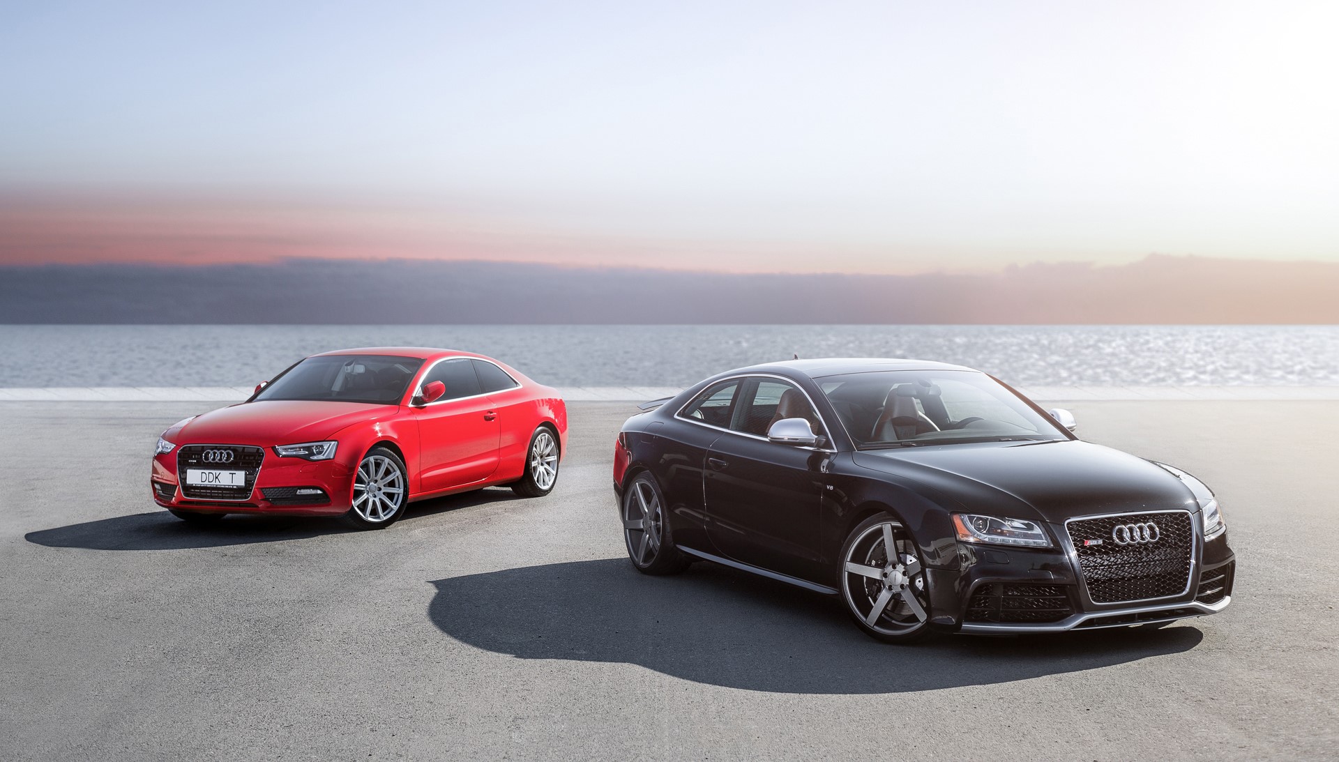 Two Audi RS5 cars on a beach HD Wallpaper