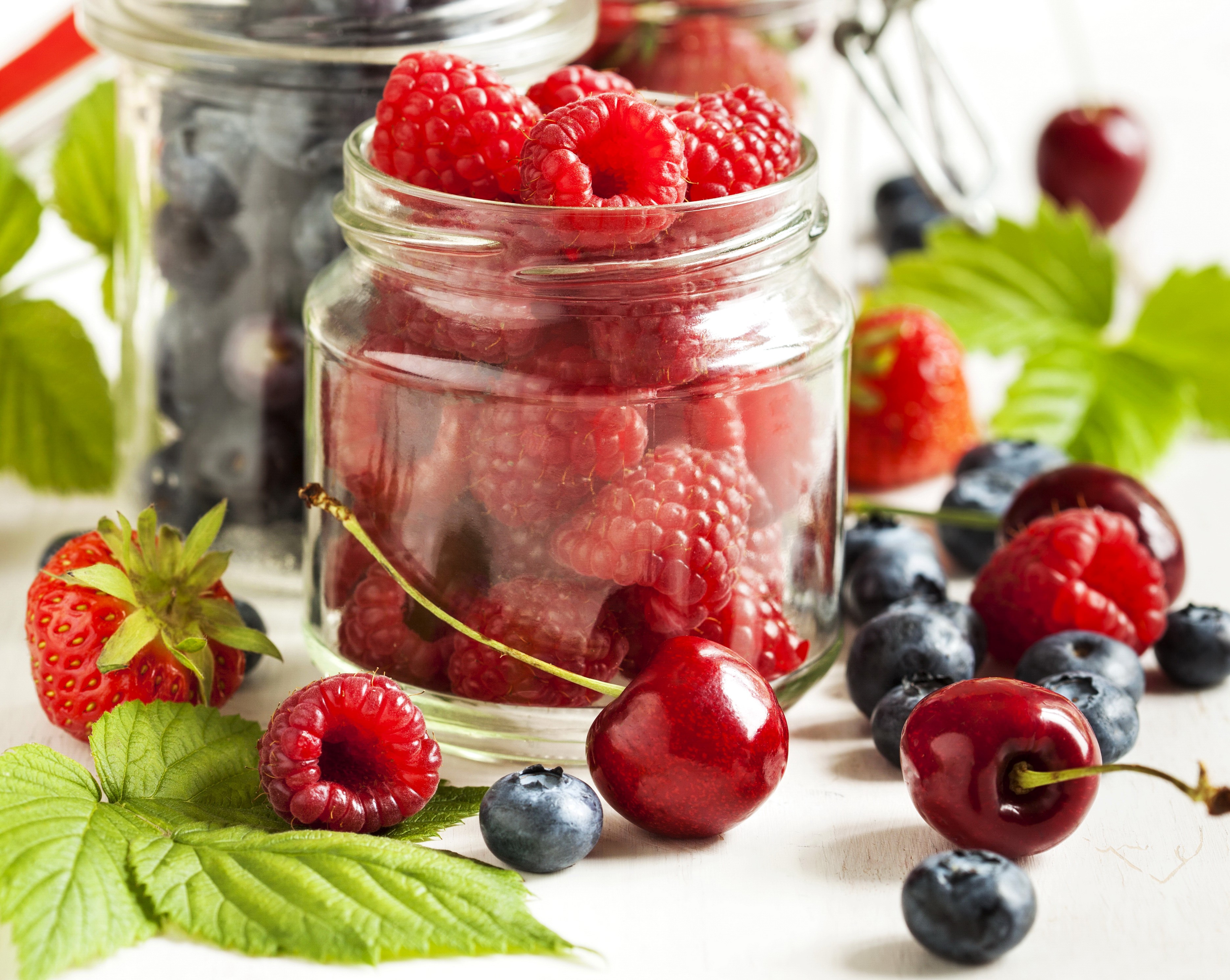 Jars of Raspberries, Blueberries, and Cherries HD Wallpaper