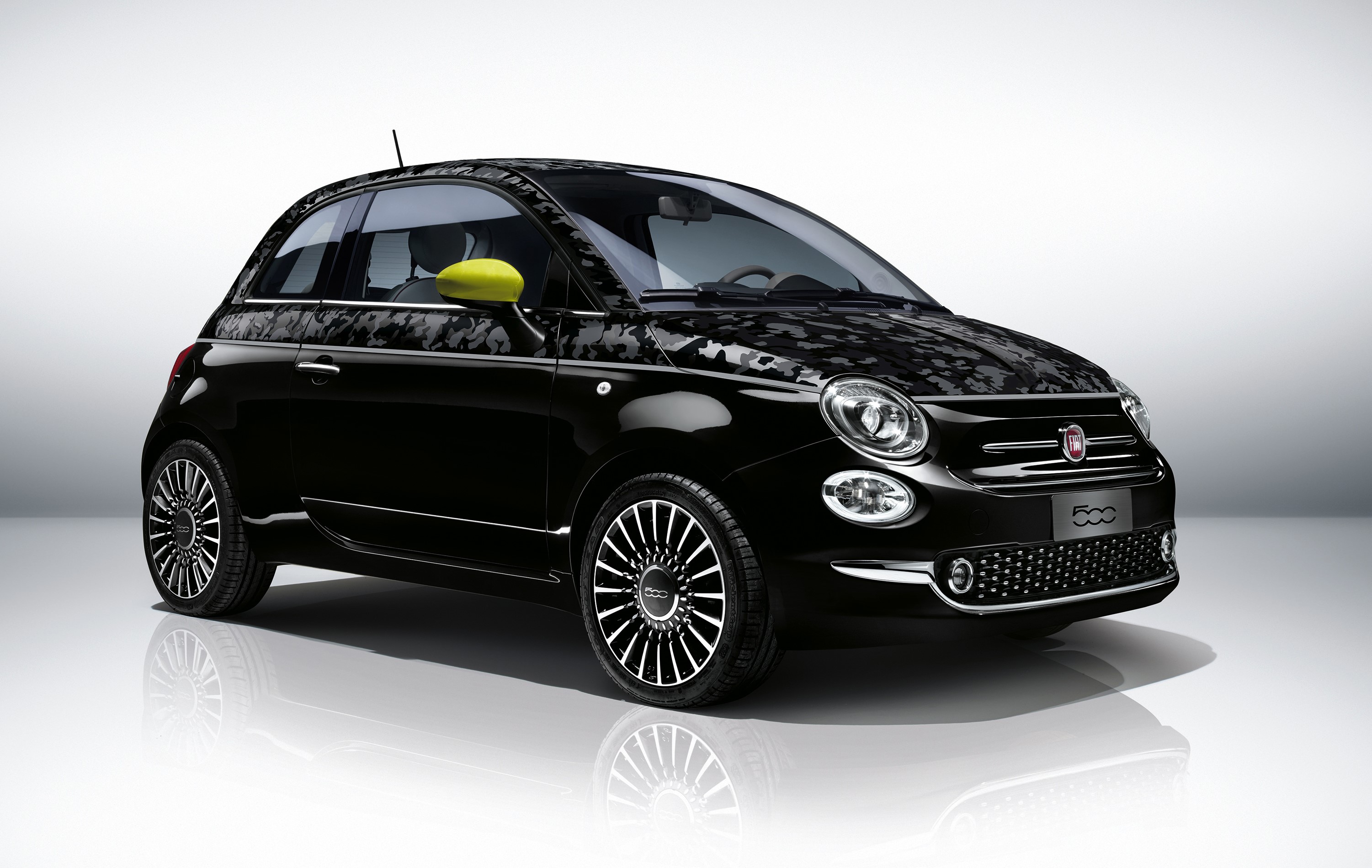 Black Fiat 500 with camouflage pattern and yellow mirror caps HD Wallpaper