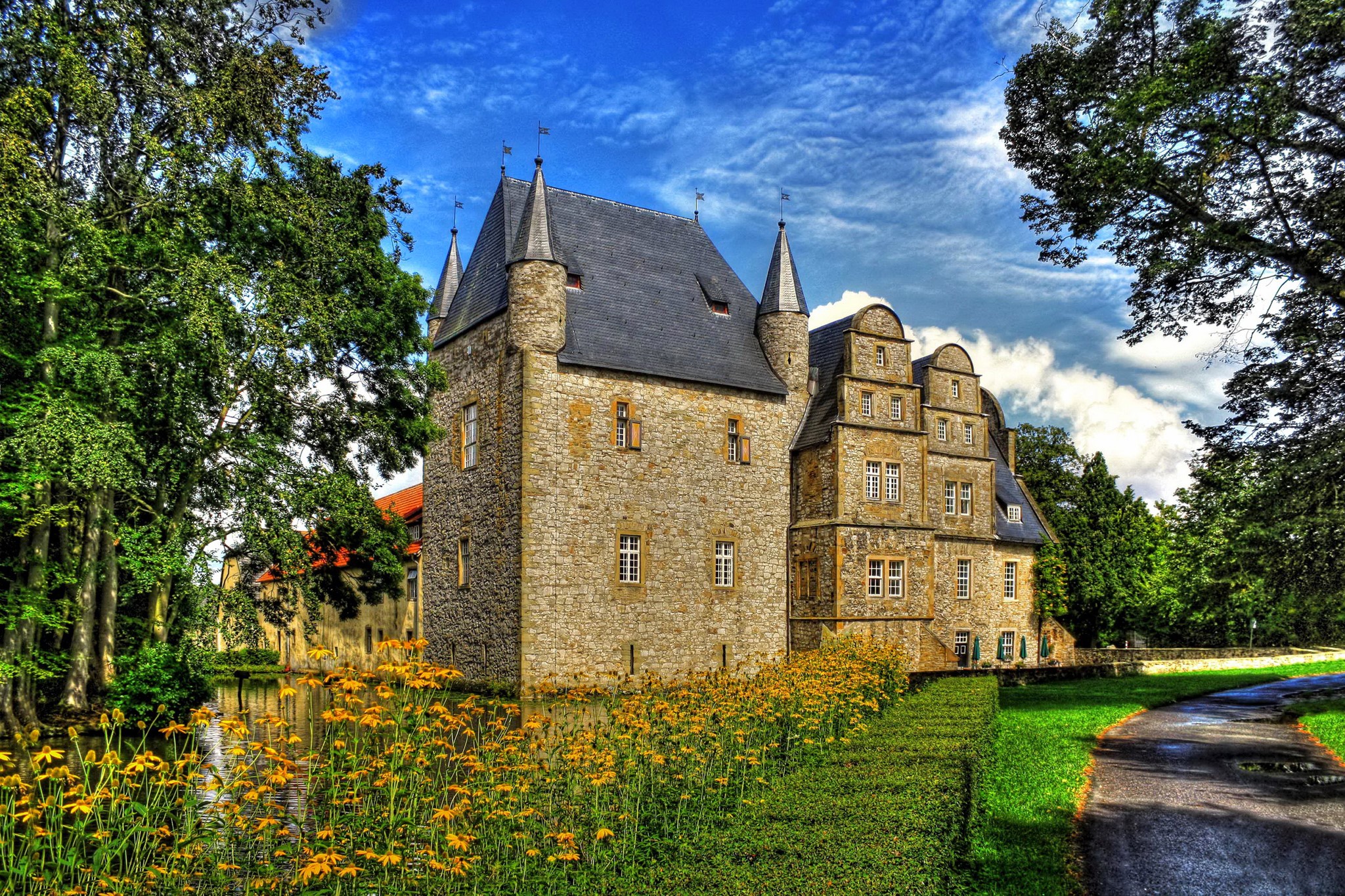 Schlenburg Castle in Germany surrounded by trees and water HD Wallpaper