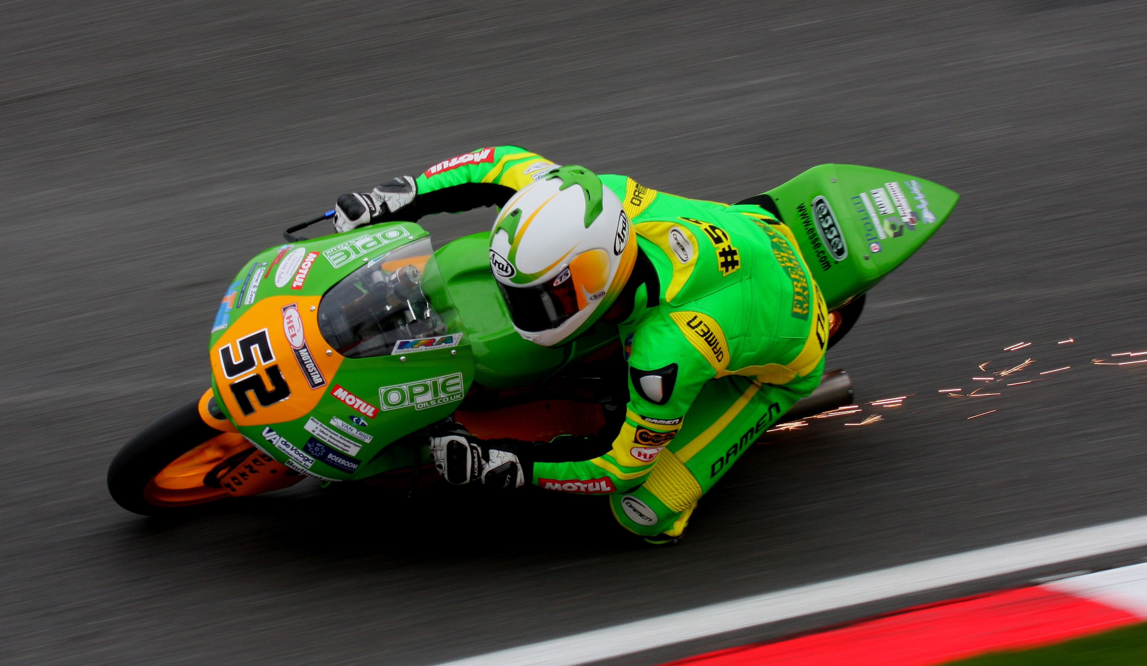 Motorcyclist #52 in green and yellow racing suit HD Wallpaper