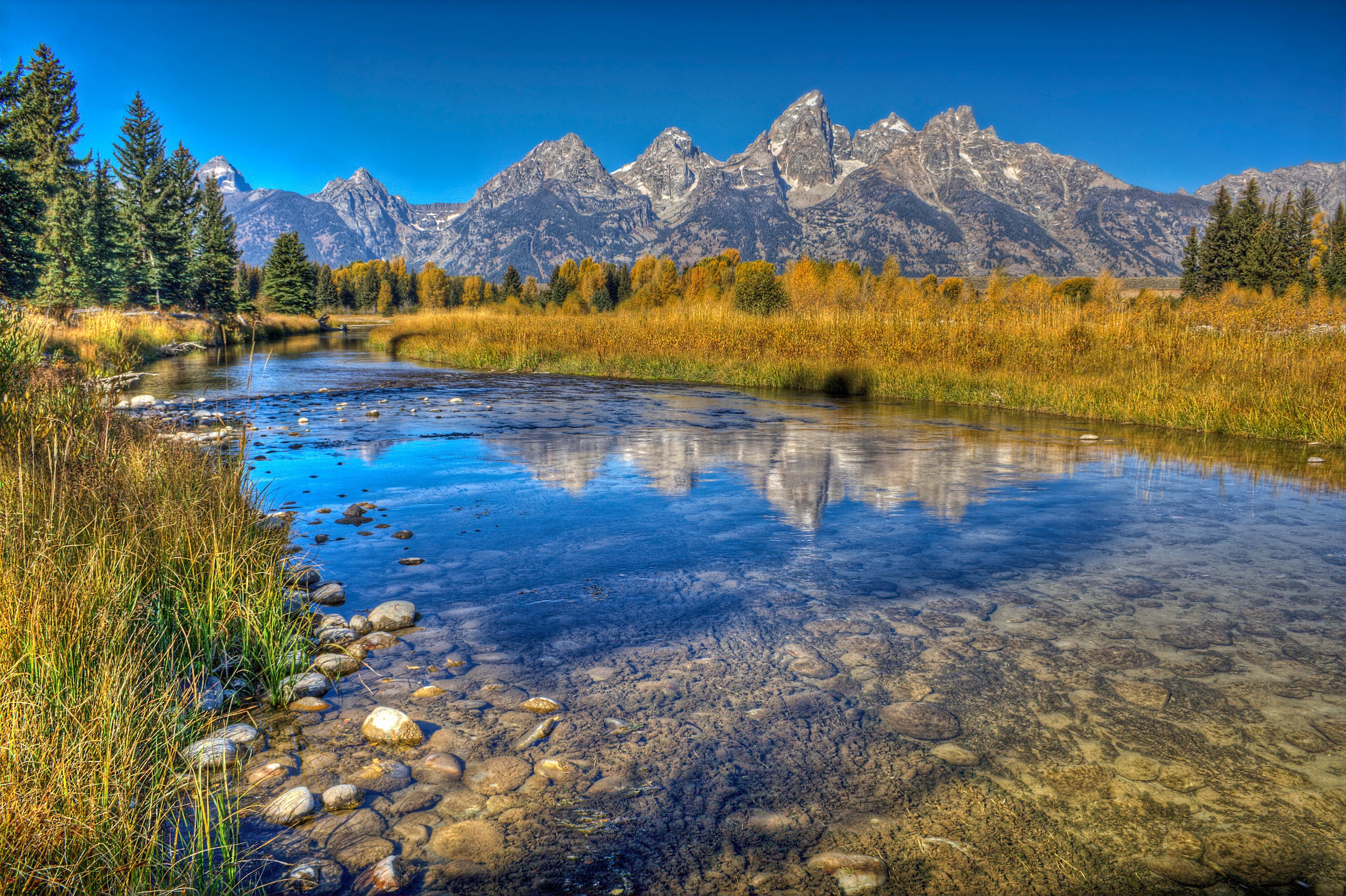 Grand Teton Mountains reflected in a river HD Wallpaper