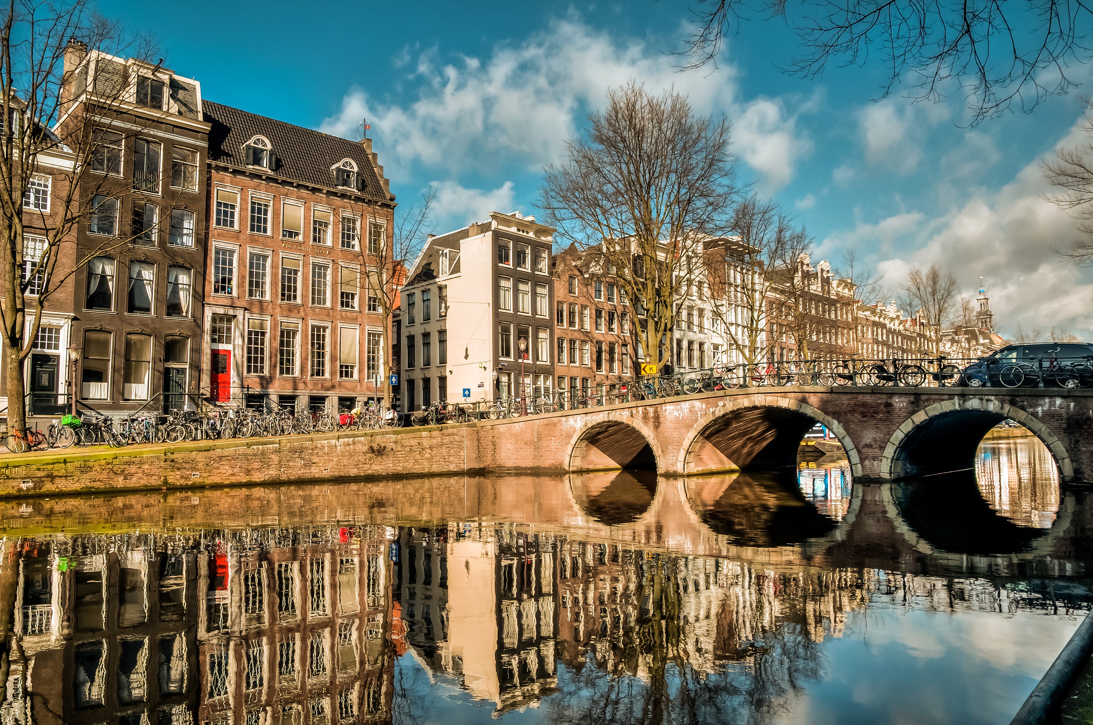 Amsterdam canal with bridges and houses HD Wallpaper