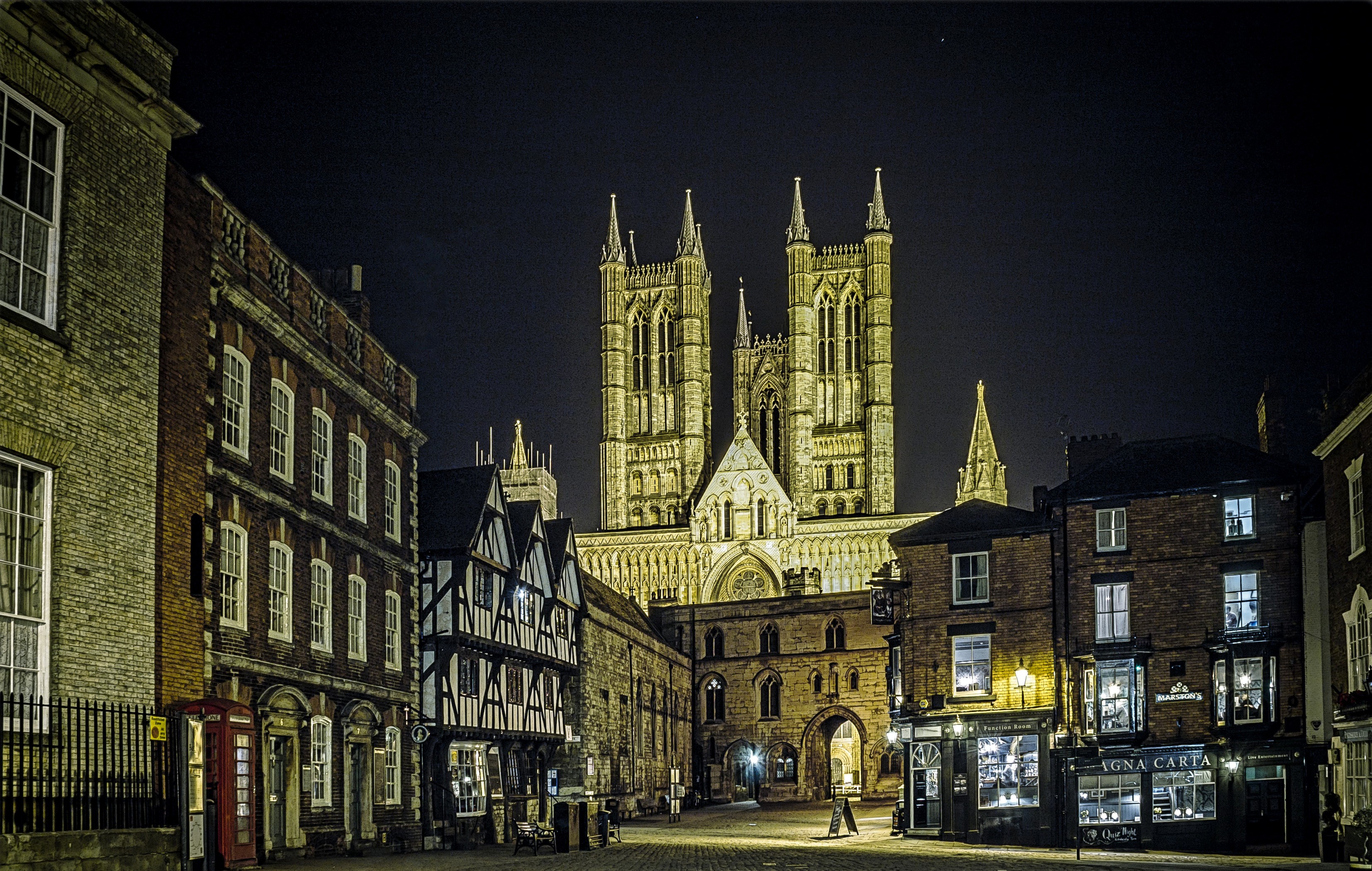 Lincoln Cathedral at night with historic buildings HD Wallpaper