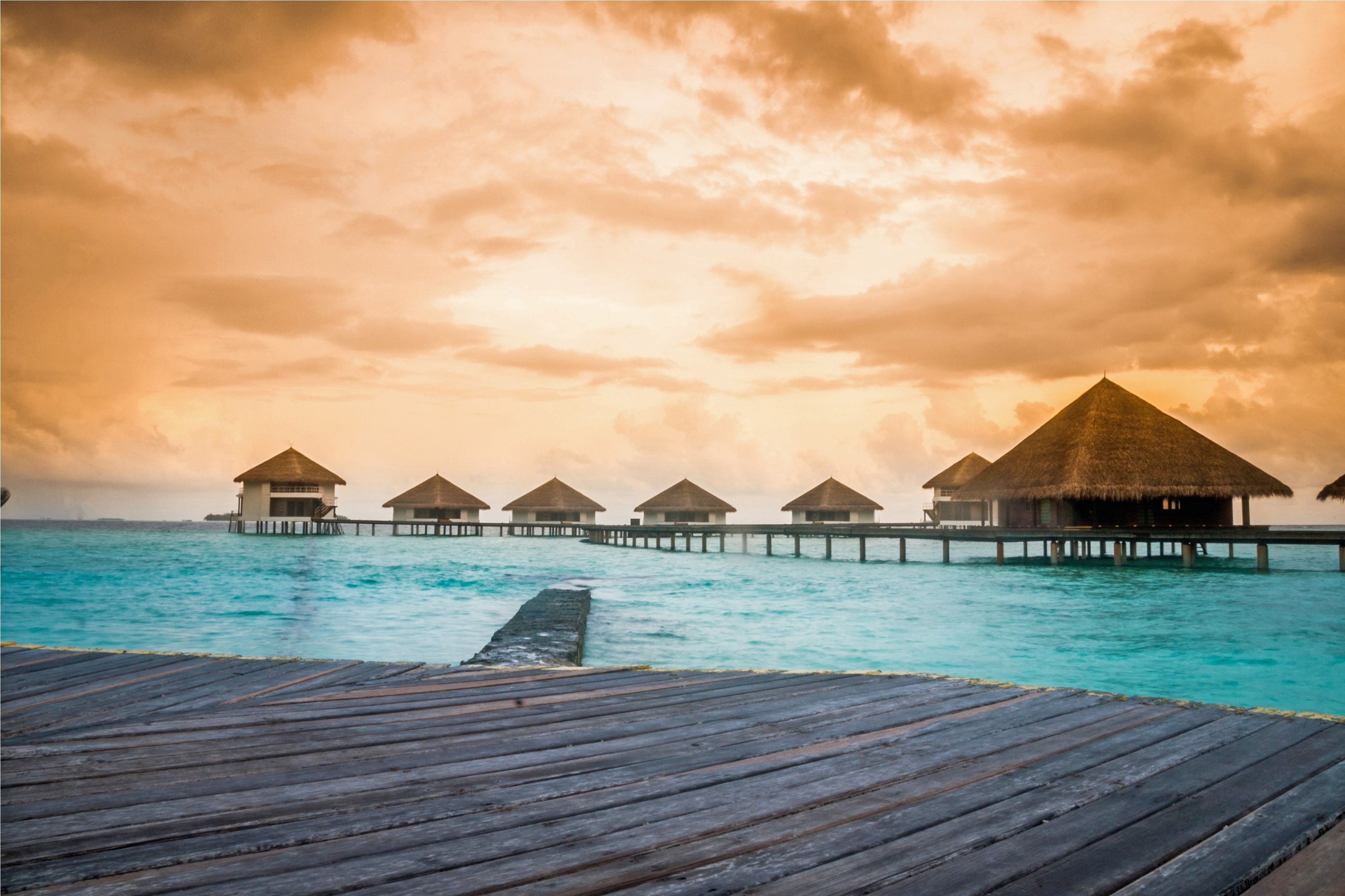 Overwater bungalows in the Maldives at sunset HD Wallpaper