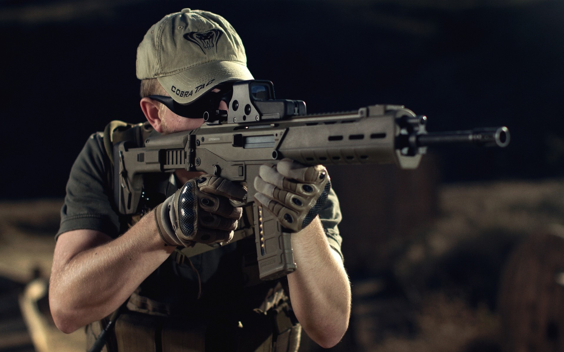 Soldier aiming an assault rifle with a baseball cap HD Wallpaper