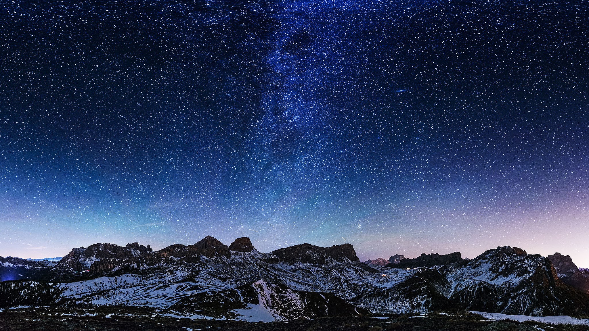 Milky Way over snow-capped mountains at night HD Wallpaper