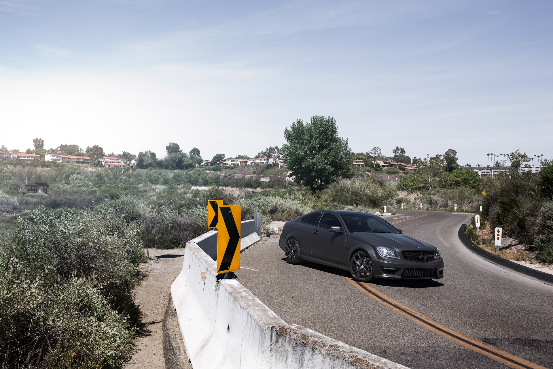 Mercedes-Benz C63 AMG Coupe on a Winding Road HD Wallpaper