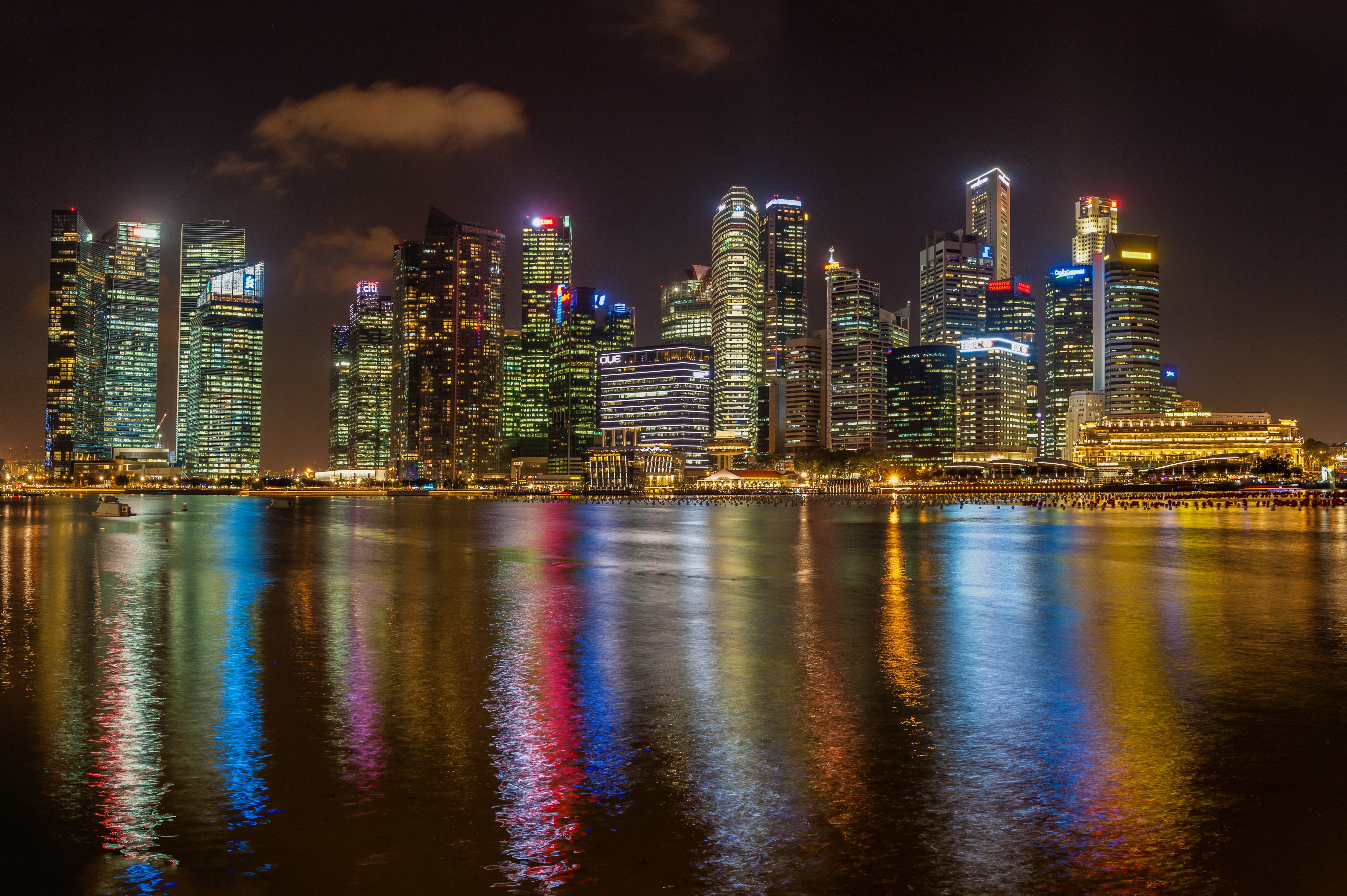 Singapore skyline at night with river reflections HD Wallpaper