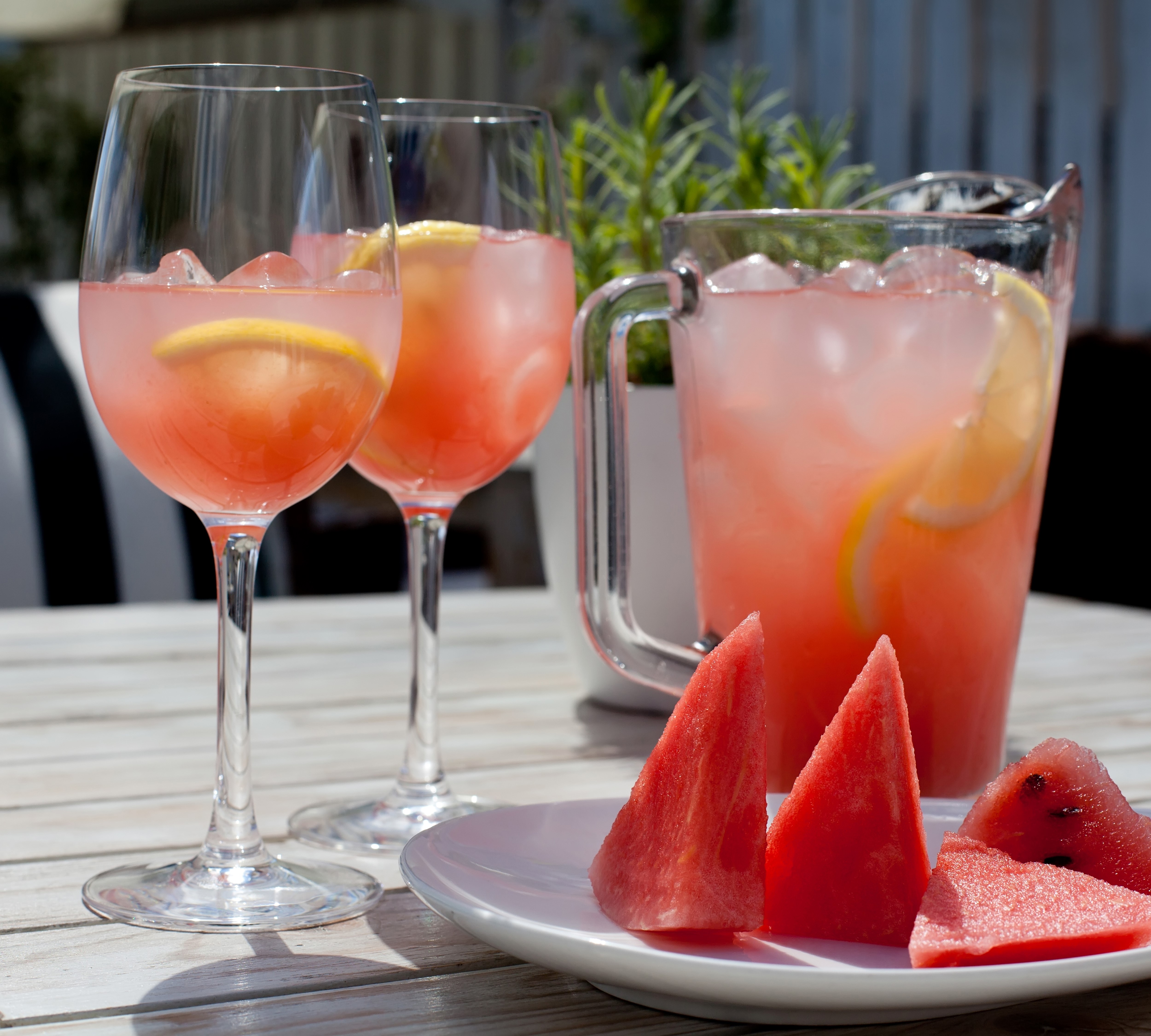 Watermelon Juice with Lemon in Stemware and Pitcher HD Wallpaper