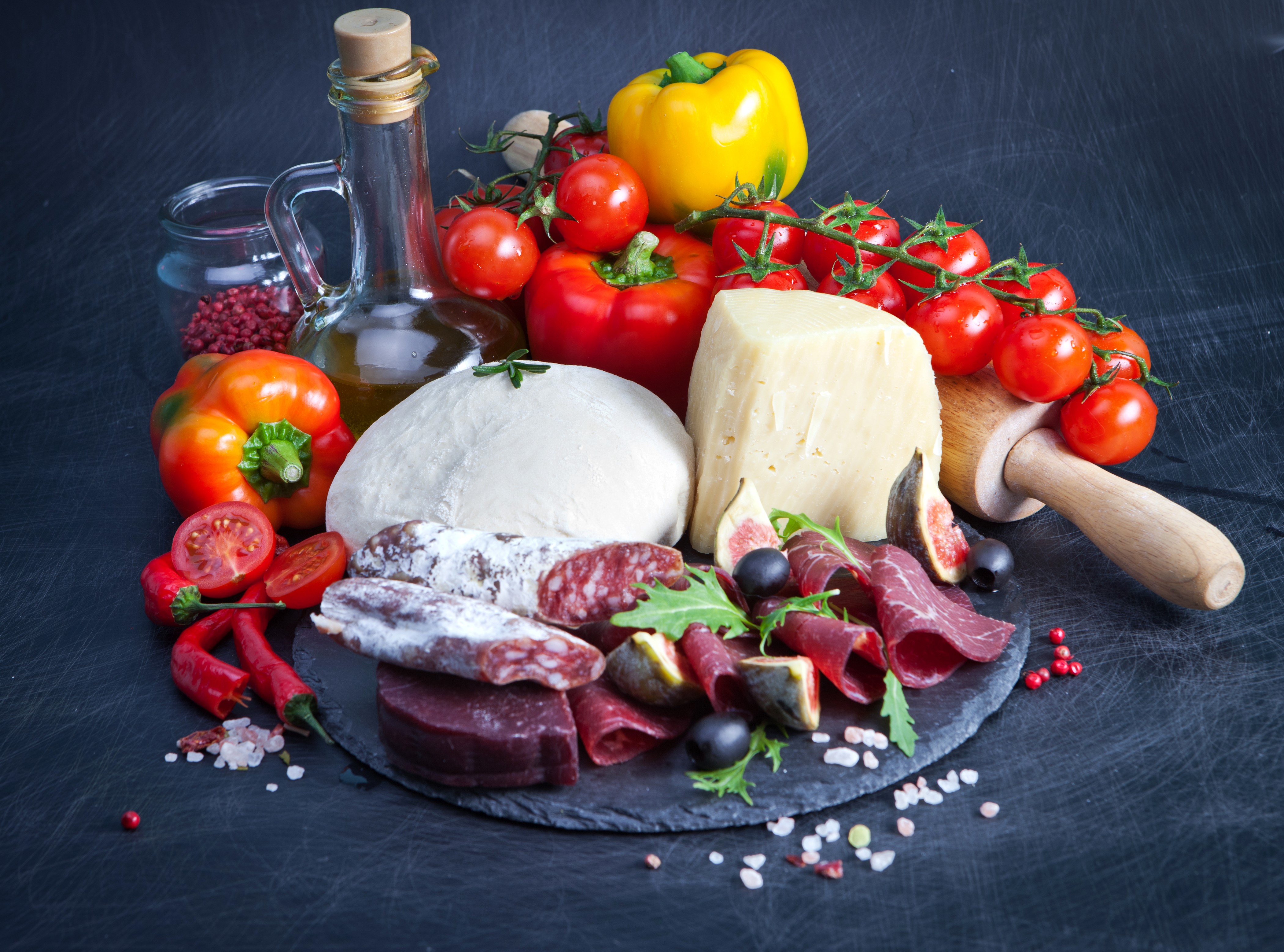Still-life of pizza ingredients with cheese and cured meats HD Wallpaper