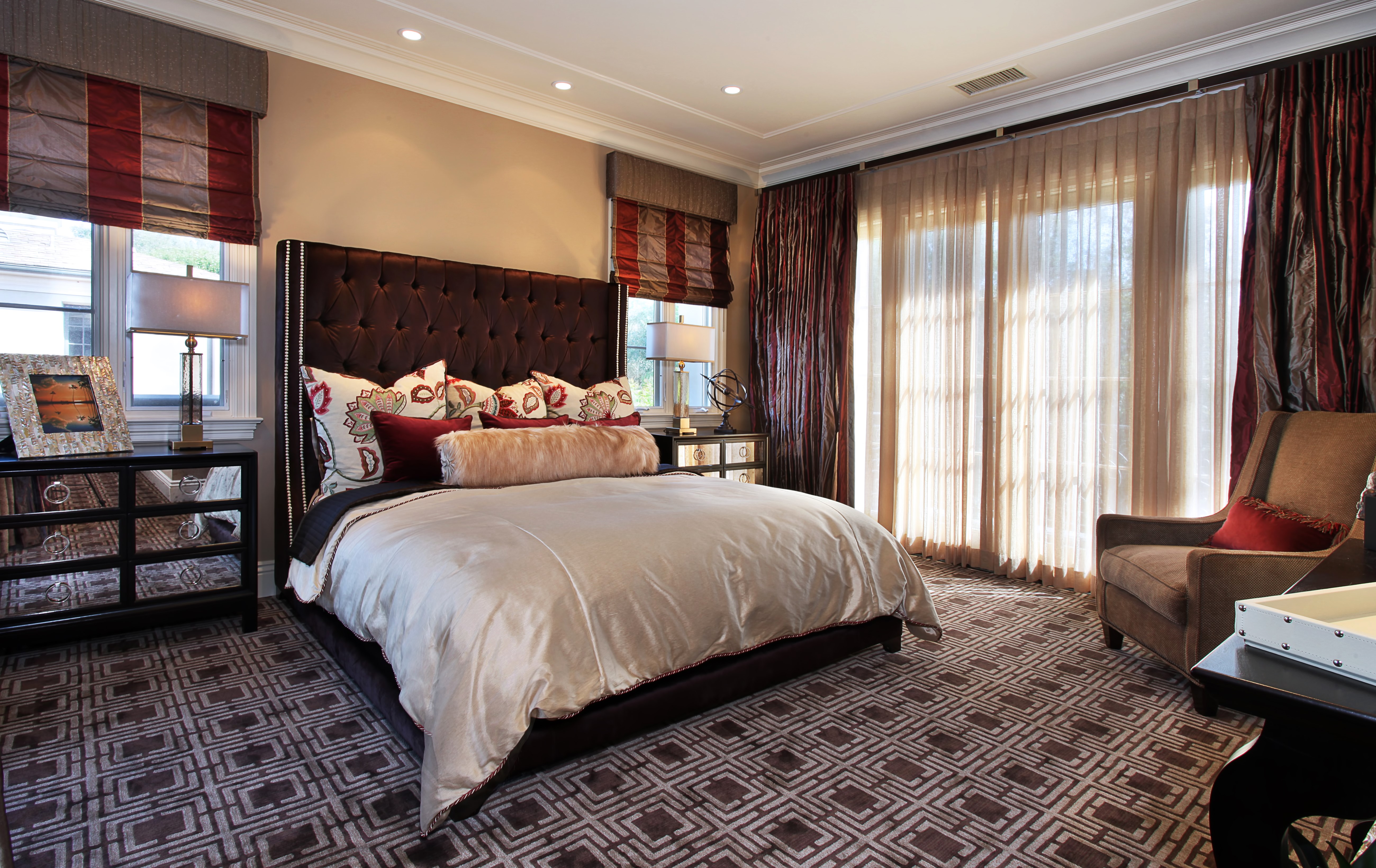 Luxury Bedroom with Tufted Headboard and Patterned Carpet HD Wallpaper