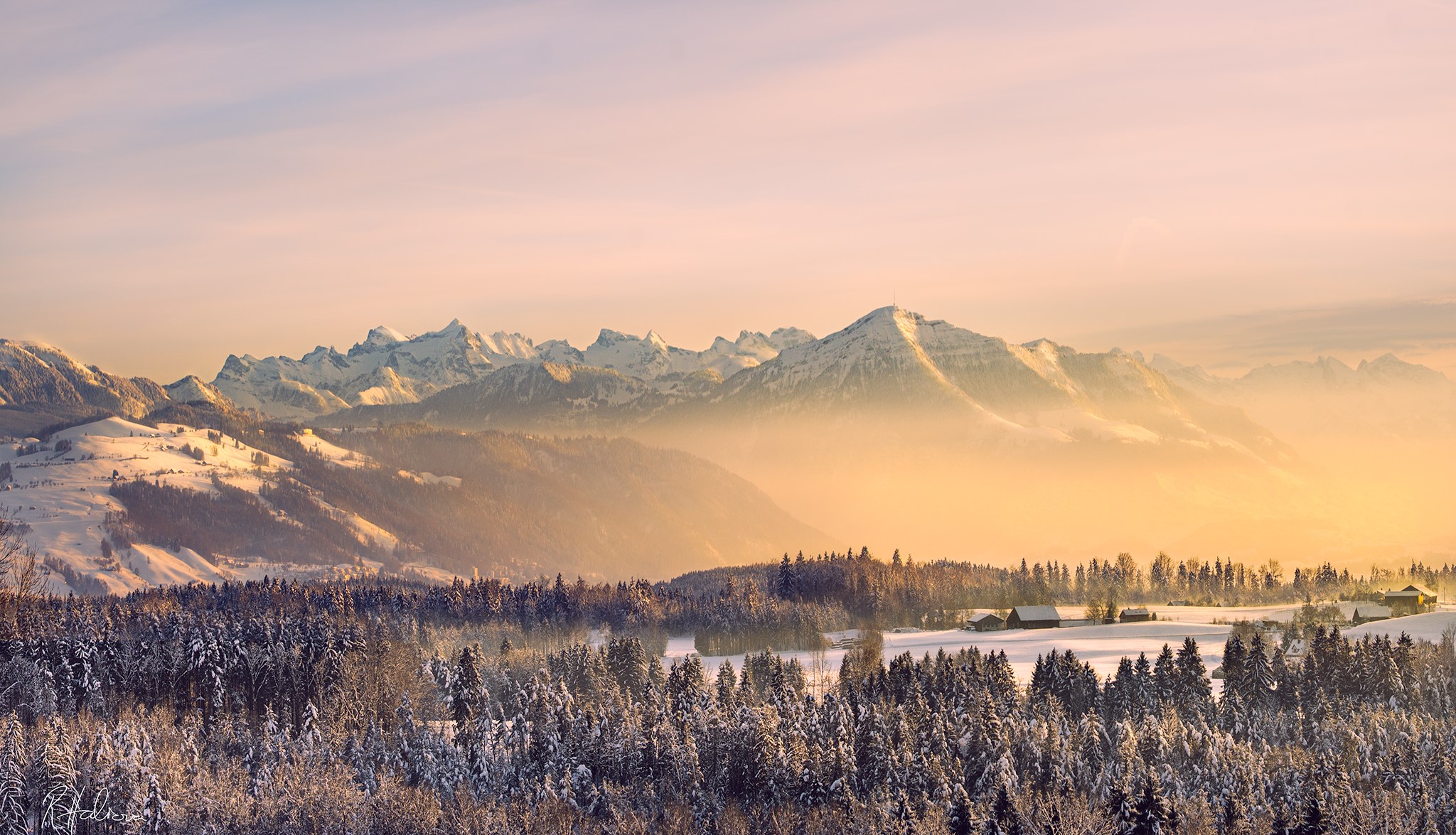 Snowy mountains and forests at sunset HD Wallpaper