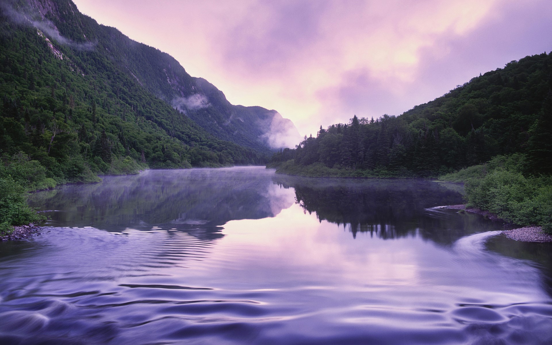 Misty mountains and a calm river at sunrise HD Wallpaper